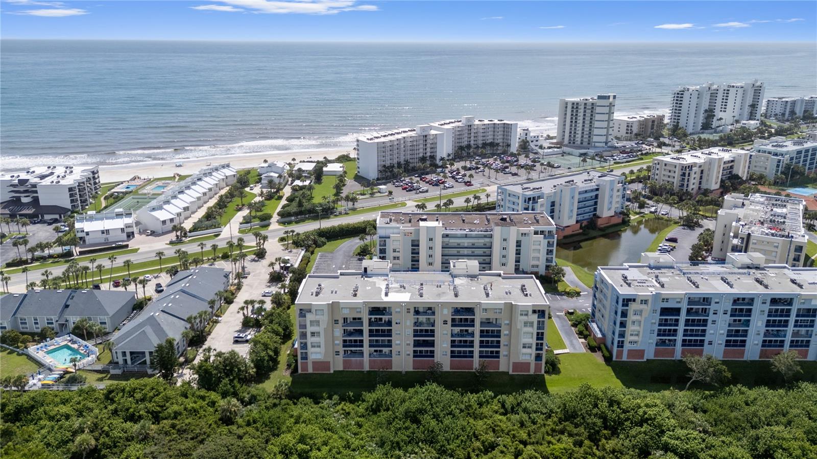 This Amazing furnished three bedrooms and two Bathrooms condo sitting in Ocean Walk. Once in you'll feel like at home. Move-in /turnkey ready. Do not miss this opportunity to live just a short distance from the beach. With a Great Ocean view, clubhouse and the pool. Main bedroom has a large closet, double sinks in the oversized bathroom, in the main bedroom separate sliders to the Lanai. The dining room, living room combination gives a spacious and bright feeling of living in the perfect place. The updated kitchen island is convenient for serving, food preparation and family gathers. Beautiful second guest room with large closet. Guest bathroom is right outside guest room. Lots and lots of closets and storage space. The convenience of the under-building garage and being close to the elevators, makes shopping and visiting easy while protecting your Vehicle from the sun and Wheater's. An additional large storage closet is located close to the unit. Resort style living!! Two recreations buildings. 2 pools, 2 spas. 2 work out rooms. Tennis courts. Access to the ocean is across the street. Shuffleboard courts and Basketball courts; also, Sauna is available onsite. 2 parking spaces are available (1) inside (covered) and 1 outside. Plenty of guest parking spaces also provided. Garage is the first level of the building. Storage unit for each condo on same floor. Incredible investment opportunity!! Close to National Seashore Park where you can enjoy New Smyrna's rich history and wildlife. Property includes elevated boardwalk and biking trails.