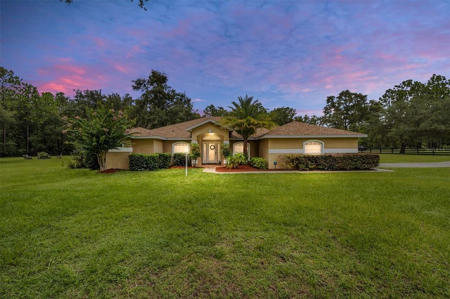 IDEAL situation if you are looking for an amazing home and opportunity to run a large business at the same time!!!  STUNNING 4 bedroom, 2 full bathroom, 2 half bathroom plus office pool home that showcases a 5,200 sq ft detached workshop perfect for running a business on over 2 gorgeous acres in desirable Rolling Hills! See the home video here... https://www.youtube.com/watch?v=0-EBxp18CWI This amazing property has so much to offer and is move in ready.  The main home features desirable split floorplan with plus size primary suite offering plenty of space and spa like primary bathroom with lovely garden tub, separate shower, dual vanities and attractive travertine stone floor throughout.  Chef's kitchen offers lots and lots of cabinet storage and showcases beautiful granite counters and s/s appliances, and overlooks family room and outdoor lanai.  This home has good sized bedrooms and separate office space, as well as private dining room, additional living room, laundry room and two car garage.  Plenty of natural light comes through the many windows of the home and the home dons attractive travertine stone flooring throughout and has a new roof as well!  An amazing paver lanai has been recently added to accentuate the spectacular salt water and heated pool with spa, as well as a convenient outdoor bathroom and outdoor shower.  Adjacent to the lanai is a perfectly situated outdoor eating bar area with grill and it overlooks the expansive, two acre, fenced in yard which offers plenty of peace and tranquility.  Beyond the screened in lanai is a newly constructed paver firepit area that is a great place to sit back and relax while you admire the evening pool and firepit lighting and sit under the stars.  In addition to this amazing home and all it features, an incredible, detached 5,200 sq. ft. workshop sits right on property.  This building is heated and cooled and contains a lot of space to do whatever you would like, especially running a business venture.  There are several office spaces, restrooms and even a pickleball court inside this workshop/building.  The possibilities are endless for what this space can be used for.  All furnishings on property are negotiable or purchase.  This property offers a lot of bells and whistles and has been well cared for so schedule your appointment today to visit and consider this prime investment.  There is also an additional one-acre parcel of vacant land behind this property that could potentially be sold if a buyer would like added space.  Great location that features a beautiful lake and park just four miles away that includes tennis courts, basketball, racqetball, walking trail and more.  Welcome HOME to Rolling Hills!