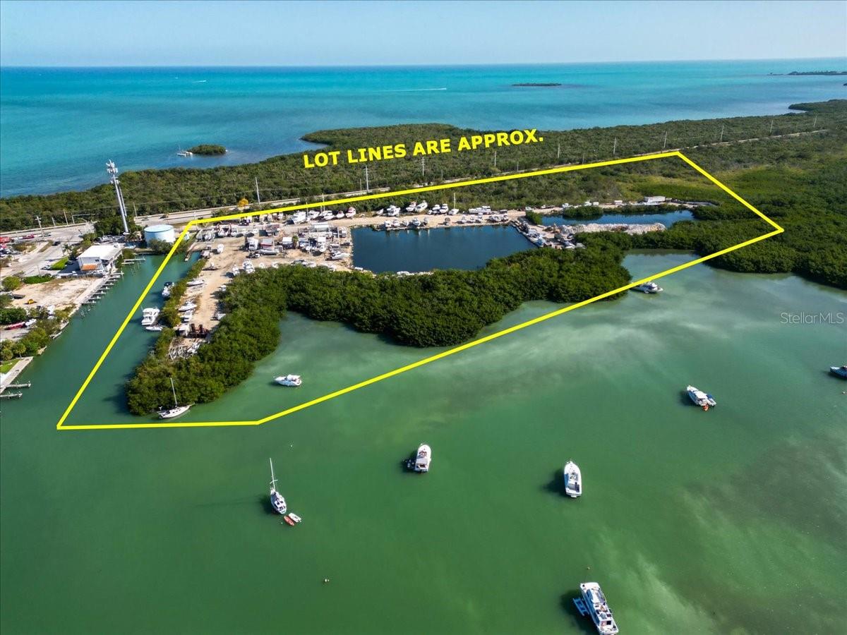 OCEAN FRONT PROPERTY WITH FANTASTIC BUSINESS OPPORTUNITY IN MARATHON FL....Driftwood marina and storage has been in business for many years and now needs new owner to take over and replace the buildings and create new business venture and marinas and build ocean front resort hotel for visitors coming to Marathon.
