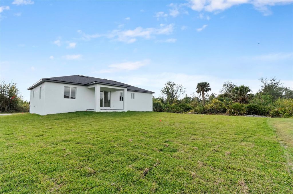Photo of 13438 Mcintosh Avenue, Port Charlotte, FL 33981 (MLS # O6428422)