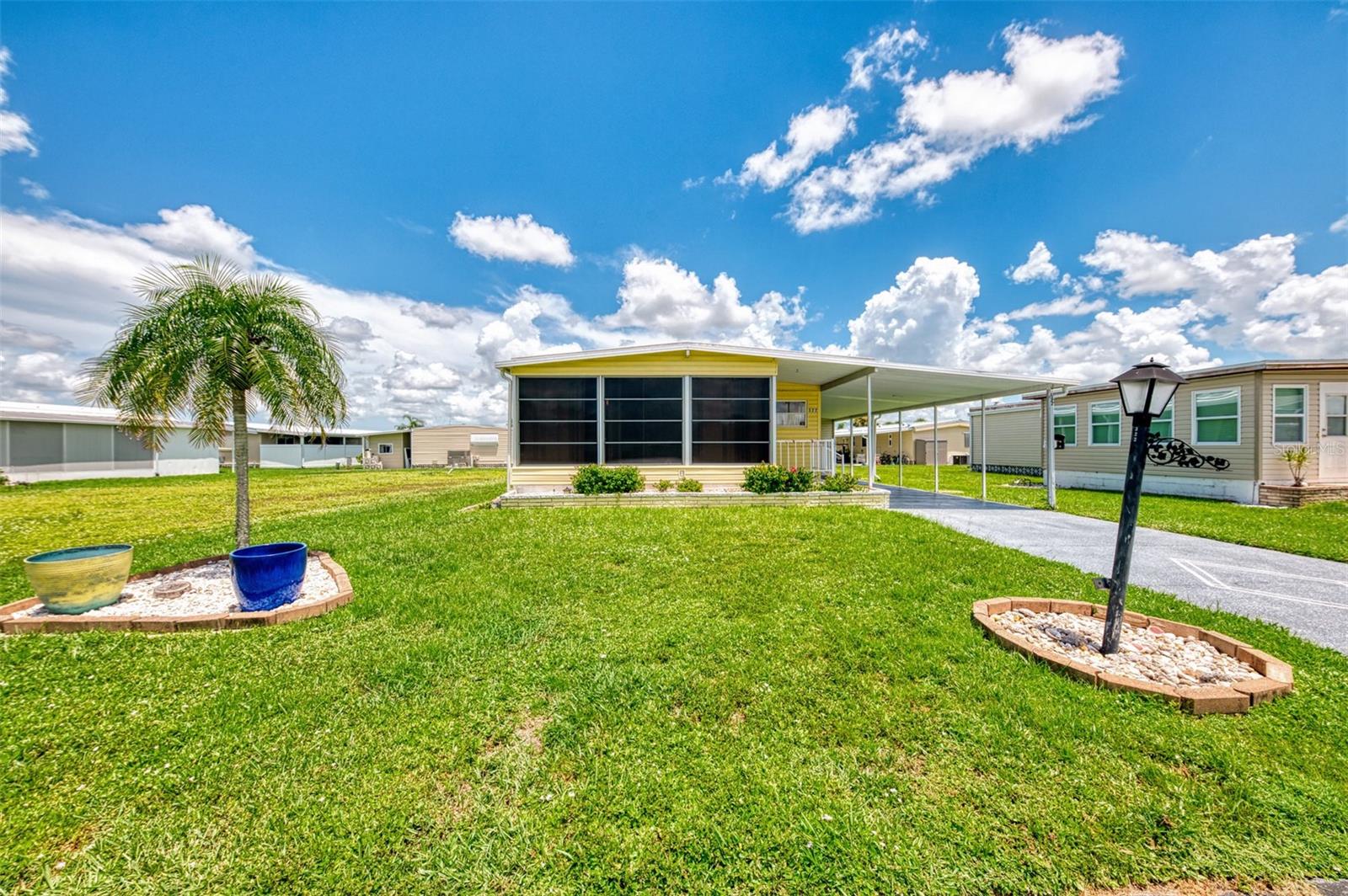 LOCATION, AMENITIES and PRICE- Check, Check and Check!!! This 55+ Community offers a Wonderful Lifestyle on Florida’s Gulf Coast with boat access to the Gulf and easy access to the beaches, airports, I -75 and numerous entertainment, shopping and dining opportunities. You Will Love all the Recreation options available with 2 Clubhouses, 2 Heated Pools, gym/fitness center, pickelball, tennis, shuffleboard and basketball courts, library and more...There is no shortage of activities in this community! Lets us know what your offer is for This Turkey Home offing 2 Bedroom, 2 Bath, large kitchen w/pantry, breakfast bar, tiled backsplash, lots of cabinet space, Dining room w/built-in hutch, Living room w/electric fireplace, sliding door to a front enclosed Florida room w/ceramic tile floor, Guest bedroom w/double closet, Guest bath w/hi-boy commode, tiled tub/shower, vanity and linen chest, Primary bedroom w/large walk-in closet, vanity and bath w/tiled walk-in shower. Recent Improvements- A/C 2019, Water heater 2021, Roof over Florida room 2022, Roof w/transferrable warranty 2023 and Painted drive to a long carport. Additional features- Extended utility room w/storage, work bench, washer/dryer, deep sink, chest freezer, Located near clubhouse and its amenities. Ask about Seller Concessions for Buyer!