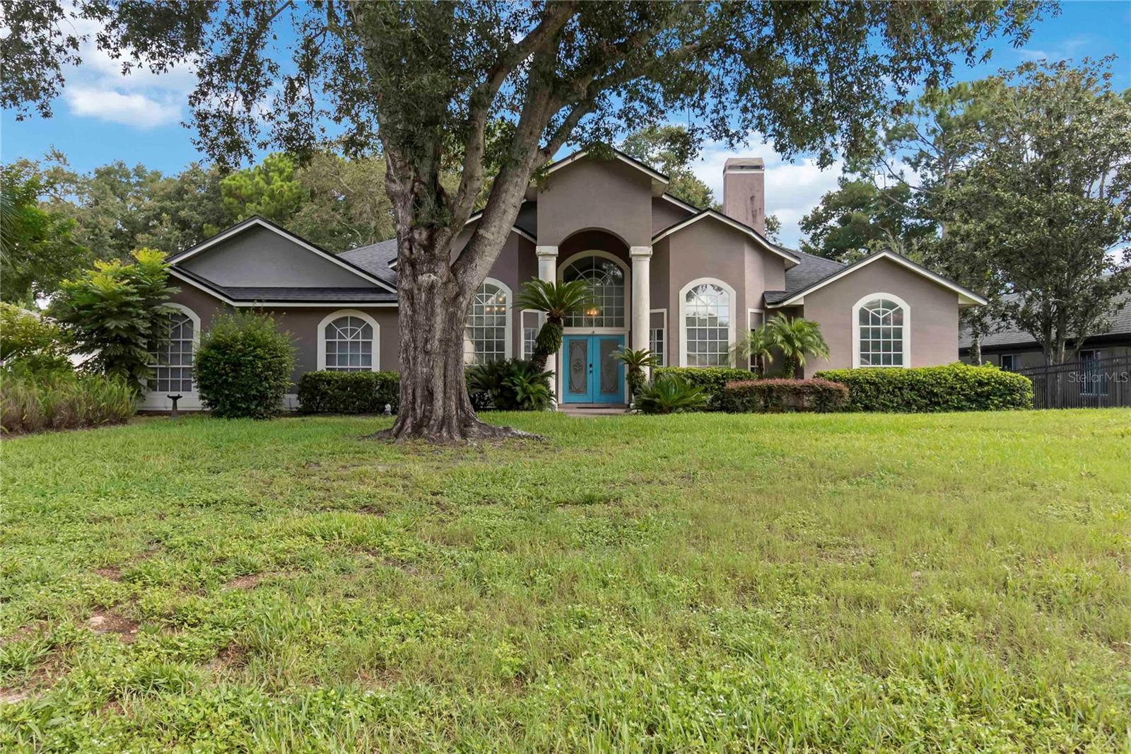 LAKE MARY POOL HOME! HUGE BACKYARD!! NO HOA!!! This 4 bedroom, 3 bathroom, 3-car garage property sits on a lot that measures over three-quarters of an acre with a backyard that just keeps on going. Plenty of lawn outside of the pool cage with shade trees that create a rustic atmosphere for swinging hammocks during the day and staycation campouts at night. The backyard sits adjacent to Lake Bingham for lake views from a variety of areas. When life keeps you indoors, this spacious property allows for both privacy and gathering depending on what the day brings. The split plan bedroom arrangement keeps the primary suite on one side of the house and the secondary bedrooms on the other side with common areas in between. Pocket doors allow both bedroom areas to be sectioned off from the main gathering areas, and the formal dining room and additional flex space (currently a media room) have doors to allow compartmentalization if so wished. The living room has 3-panel glass sliding pocket doors that nest into each other, completely opening up the glass for a fluid transition to the covered lanai and pool area, all screen enclosed for year-round comfort. The chlorine pool has an overflow hot tub & outdoor shower, and the lanai offers an outdoor kitchen for all the entertaining you will surely do. There is interior laundry with countertops, cabinetry & utility sink, and the 3-car side loading garage has a work bench and peg board walls for organization. Seller updates include 2024: shed, irrigation control box; 2023: replaced the larger garage bay door and its motor, remodeled both secondary bathrooms, repipe; 2021: kitchen refrigerator; 2020: hot WATER HEATER & dishwasher; 2019: replaced one of the two A/C units, 2018: ROOF, exterior paint, rebuilt pool cage; 2017: overflow hot tub heater (all dates are approximate). Additionally, there is a termite bond, and owned underground propane tanks fuel the hot water heater, fireplace & hot tub heater. Come experience this oh so worthy property for yourself. Welcome to Florida living! Welcome to your new home!!!