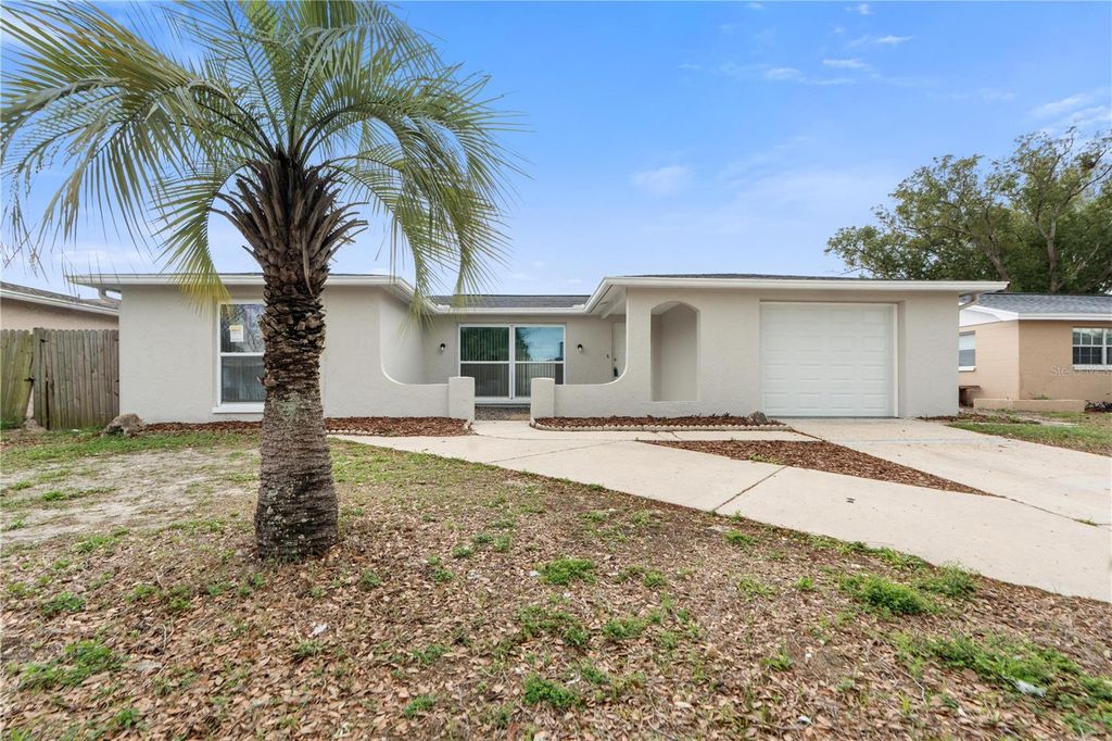 Photo of 7134 Fox Hollow Drive, Port Richey, FL 34668 (MLS # W7883909)