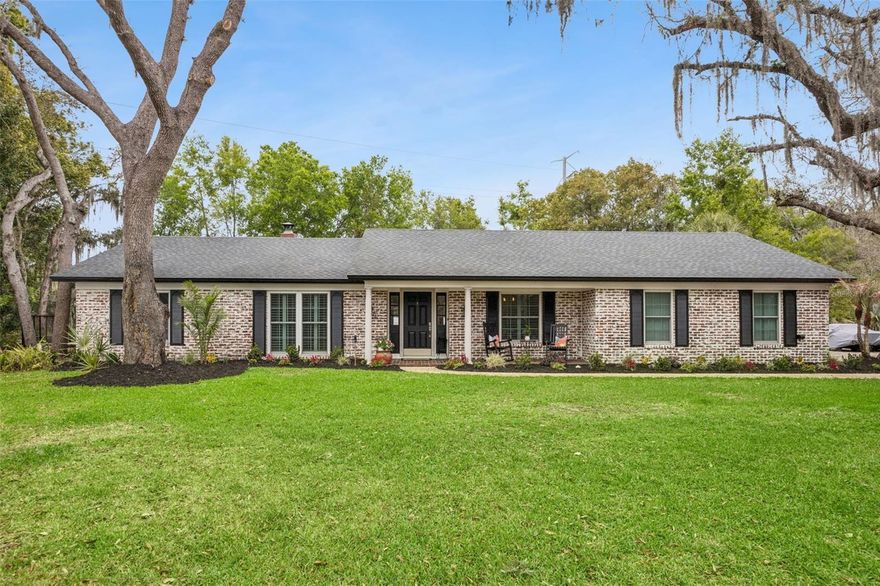 Welcome to a beautifully updated home that blends timeless curb appeal with the modern, open-concept living today’s buyers crave. From the moment you arrive, the white-washed brick exterior, freshly painted accents, and meticulous new landscaping create an unforgettable first impression.

Inside, warm casual elegance defines every space. Thoughtful designer touches, abundant natural light, all-new double-paned windows, and plantation shutters in the Great Room make this home feel both refined and welcoming. At the center of it all is the spectacular renovated Kitchen, anchored by a massive center island where everyone naturally gathers. Warm alabaster cabinetry offers exceptional storage and flows seamlessly into a fully equipped Butler’s Pantry, perfect for a coffee bar, wine bar, or both, because balance is important.

The true heart of the home is the stunning Kitchen/Great Room/Dining Room combination, designed for effortless everyday living and easy entertaining. The inviting wood-burning fireplace adds warmth and character, while a fabulous wall-to-wall built-in provides stylish space for electronics, television, and storage.

The split-bedroom layout offers privacy and function. The Primary Suite is tucked away from the secondary bedrooms and features a walk-in closet plus an updated bath with a beautifully designed tiled shower. Three additional bedrooms offer generous closet space and share an updated hall bath that also serves as a convenient pool bath with direct access to the paved, screened lanai.
And then there’s the backyard. Truly the cherry on top. The shaded outdoor gazebo is ready to become everyone’s favorite gathering spot, complete with room for family and friends, a massive flat-screen TV, and that unforgettable oversized fan keeping things cool while the big game is on. From there, wander over to the firepit area for evening cocktails, then challenge your guests to a match on the newly turfed bocce court, which also doubles as a fun putting practice area. This is more than a backyard. It’s a lifestyle.
Located in highly sought-after Sweetwater Oaks, this home is zoned for incredible schools and is within walking distance of highly regarded Sabal Point Elementary. Residents enjoy exceptional community amenities, including access to Lake Brantley, visible from the front porch, and nearby Brantley Beach, offering a swim area, fishing dock, community boat ramp, sand volleyball, covered picnic gazebo, grilling area, tot lot, and basketball court. It’s the perfect setting for outdoor fun, neighborhood gatherings, and making lifelong friends.
This isn’t just a home. It’s a lifestyle upgrade. And yes, the phone is already ringing, so HURRY!