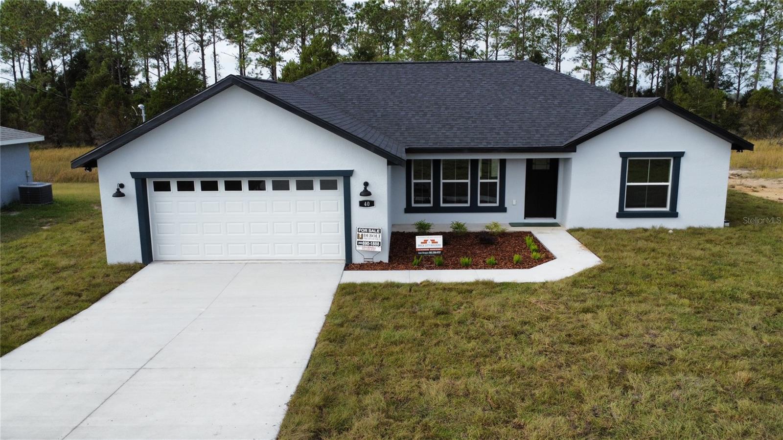 Under Construction. Available September Discover your new home in Silver Springs Shores This new construction gem, with no HOA fees, featuring: - Block and Stucco Construction - 3/2 Split with Open Floor Plan - Vaulted Ceiling, Tile Bathrooms - Master Bedroom with Walk-in Closet and Tile Shower - LVP Flooring, Granite Counters on Solid Wood Cabinets - French Door to large covered Back Patio - 2-Car Garage, 1506 Sq Ft Living, 2203 Sq Ft Under Roof Kitchen Highlights: - Island with Breakfast Bar - Stainless Steel Appliances, Shaker Soft Close Cabinets - Granite Countertops, Open to Main Living
- One Year Builder Warranty
** some photos virtual staged
** photos are of model home Colors, granite, LVP may be different
** Seller is a licensed Real Estate Agent