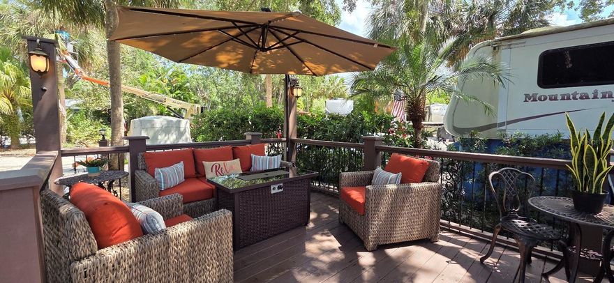 Buy this RV Lot in Central Florida and Rent it out when not using it!! WELCOME TO RIVER RANCH, Florida’s Luxury RV Resort with access to Lake Kissimmee!  This privately owned RV lot is located in Phase 2 and offers GORGEOUS landscaping and a large shade tree with a custom deck built around it!  This focal point offers shade and privacy and a cozy outdoor living space!   This lot has an extended concrete patio with room for outdoor kitchen space, additional tables and seating areas and has a storage shed. The concrete has been stamped and offers a clean decorative look to the space.  There is also dedicated golf cart parking space.  This lot offers shade and sun  - the perfect combination!   River Ranch RV Resort is perfect for weekend vacations, family camping, seasonal living! River Ranch RV Resort offers beautiful landscaping and privately owned RV lots.  Looking for entertainment?  IT'S ALL HERE!   River Ranch RV Resort is in the same location as Westgate Resort and Rodeo – giving RV Lot owners access to MANY fun things to do! For starters, a brand new waterpark!!   There is a LIVE Rodeo every Saturday night – an excellent display of showmanship and fun for the entire family! There is even a Saloon (family friendly), with LIVE bands, DJs, dance parties and they give line dancing lessons for free.  There is an adventure park which has a bounce house, mechanical bull, climbing tower, Arcade, mini golf, outside movie on the greens, bicycle rentals, airboat rides, river boat rides, swamp buggy, hayrides, petting farm, trap & skeet range and a bow target for shooting. There are several places to eat on property.  The River Ranch Chop House serving delicious food and drinks, a waterfront Smokehouse Grill serving delicious BBQ, a pizza shop and an ice cream and coffee shop (serving Starbucks.) There is also a General store and a Western store to grab all of your favorite Cowboy/Cowgirl finds! Watch the Bison, Steers, Horses and other wildlife!  Don’t forget to check out the Petting Farm!!