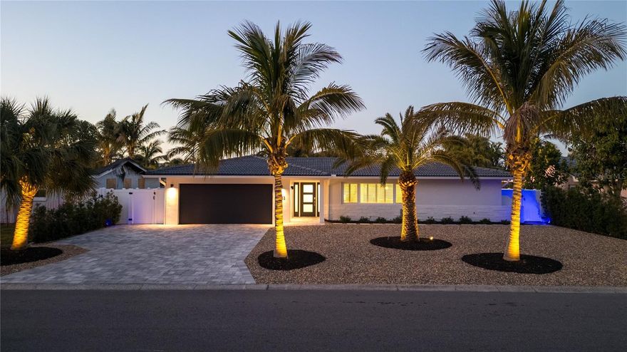 This pristine, move-in ready home has been meticulously remodeled from top to bottom by Tampa Bay’s own Mitchell & Son Quality Construction. Every detail has been thoughtfully designed to blend modern luxury with timeless elegance.

Step into the heart of the home—a chef’s dream kitchen featuring rich mahogany-colored hardwood cabinets with soft-close doors and drawers, gleaming quartz countertops, and premium Samsung black stainless steel appliances. The Express Water reverse osmosis system ensures crisp, purified water right at your fingertips.

Outside, your private oasis awaits. The heated pool has been completely transformed with brand-new pavers, coping, tile, pool finish, and LED lighting. A state-of-the-art Pentair variable-speed energy-efficient pump and a Purechlor salt system ensure effortless maintenance and year-round enjoyment. The entire backyard is enclosed by 250 feet of brand-new vinyl fencing, offering privacy and two convenient access gates.

This home is designed for maximum comfort and efficiency, featuring double-pane, hurricane-rated impact windows and a reinforced garage door to keep energy costs low. The attic is newly insulated with R30 blown-in insulation, while the Ruud HVAC system and Ultra-Aire dehumidifier work seamlessly to maintain the perfect indoor climate. For the handyman, the garage is equipped with its own Mr. Cool mini-split AC system for year-round comfort.

Natural light pours through charming Bahama shutters, beautifully reflecting off the brilliantly restored terrazzo floors in the main living areas—polished to perfection for a sleek, glass-like finish. Throughout the home, you'll find all-new moldings, interior doors, and custom closet organizers, adding to the refined craftsmanship.

The fully remodeled master bathroom is a true retreat, featuring a luxurious 3/8-inch thick glass shower enclosure, elegant tilework, a stylish vanity with a quartz countertop, and modern fixtures.

Security and convenience are at your fingertips with smart locks, while the low-maintenance xeriscape yard ensures effortless upkeep. At night, Volt landscape lighting highlights the towering palms, illuminates the front façade, and accentuates the oversized driveway with ample parking.

All that’s left to do is pack your bags—this home is 100% move-in ready and waiting for its next owner to fall in love!