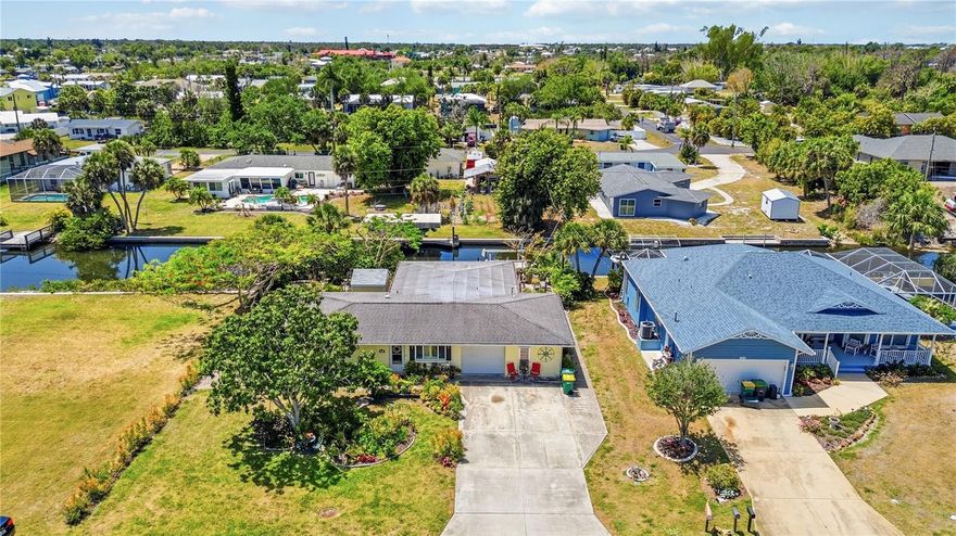 STUNNING WATERFRONT LIVING JUST MINUTES TO LEMON BAY! Welcome to this GORGEOUSLY REDONE 3 BEDROOM, 2 BATHROOM home perfectly positioned along the AINGER CREEK CANAL SYSTEM, offering approximately 15 MINUTES TO OPEN WATERS of Lemon Bay and the ultimate Florida boating lifestyle.

From the moment you step inside, you’ll notice the BEAUTIFUL LVP FLOORING flowing throughout and a thoughtfully designed layout that’s PERFECT FOR HOSTING and everyday living. The open, inviting floor plan creates seamless transitions between living spaces, all while showcasing AMAZING WATER VIEWS that truly set this home apart.

Step outside and enjoy your private waterfront oasis complete with a DOCK AND BOAT LIFT—ideal for quick access to boating, fishing, and sunset cruises. Whether you're entertaining guests or enjoying a quiet evening, the backyard offers the perfect setting to soak in the peaceful canal views.

This home has been meticulously updated with major improvements already done for you, including a BRAND NEW A/C SYSTEM (2025) with BOTH CONDENSER AND AIR HANDLER, as well as a NEW WATER HEATER—providing comfort and peace of mind for years to come. Additional features include a SPRINKLER SYSTEM to keep your lawn looking its best, a charming MANGO TREE for a touch of tropical living, and an 6x8 SHED with ELECTRIC for extra storage.

Located in the heart of Englewood, you’re just a short drive from area beaches, golf courses, dining, shopping, and all the best that Southwest Florida has to offer.

Whether you're looking for a FULL-TIME RESIDENCE, VACATION HOME, or INVESTMENT PROPERTY, this WATERFRONT GEM delivers LOCATION, UPDATES, and LIFESTYLE. Schedule your private showing today and start living the coastal life you’ve been dreaming of!