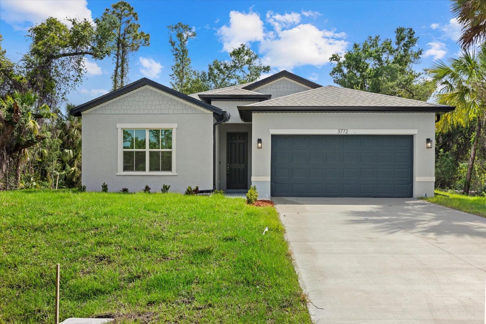 New Construction! Move-in Ready! Up to $10K in Seller Concessions for closing costs or Interest Rate Buy-Down. This beautiful 4-bedroom, 3-bathroom home with a 2-car garage is ready for you to call home. Step inside and be greeted by the spacious great room with soaring 9'4'' ceilings and elegant 8' doors throughout. The modern kitchen INCLUDES a stainless-steel Samsung appliance package, beautiful quartz countertops, and an open layout perfect for entertaining. The Primary bedroom comes complete with a tray ceiling, dual walk-in closets, and a spa-like ensuite with double vanities. The fourth bedroom, located at the front of the house, offers privacy with its own ensuite bathroom, perfect for guests or extended family. This home is packed with high-end finishes, including hurricane-impact windows, tiled showers, stylish and durable flooring, irrigtion system, and a Ring doorbell. Enjoy Florida living year-round on the covered lanai, ideal for outdoor relaxation. Selling concessions are available to make your move even easier! No HOA fees, no CDD. Schedule your showing today!
