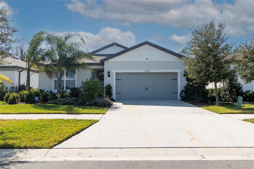 An Exceptional Find! Step into this spectacular, move-in-ready home in the highly sought-after Cedarbrook community. This 4-bedroom, 2-bath residence maximizes every inch with a beautifully efficient and functional layout. From the moment you arrive, the impressive entry welcomes you with a leaded glass front door and a spacious hallway that leads to an open kitchen, dining, and great room area. The stunning chef’s kitchen is equipped with a built-in wall oven and microwave, separate cooktop, farmhouse sink, island, soft-close cabinets and drawers, corner lazy Susan, deep pot drawers, and sparkling quartz countertops. The inviting great room, complete with recessed lighting, offers serene views of the backyard. A thoughtful three-way split floor plan makes this layout ideal for hosting guests, creating a home office, or accommodating in-laws. Bedroom 4 is privately situated behind the garage, while Bedrooms 2 and 3 are positioned on the left side of the home, sharing a full bath with stone counters and a tub/shower combo. The spacious primary suite is tucked at the back, featuring an ensuite bath with dual vanities, a glass-enclosed shower, a private water closet, and a generous walk-in closet. Enjoy the convenience of an oversized laundry room with a utility sink. Outside, the covered lanai and fenced backyard are perfect for summer BBQs, fall gatherings, and a secure space to play. With resort-style amenities,and Riverview’s expanding retail scene, this home offers the perfect blend of comfort and convenience. Don’t miss your chance to make it yours!
