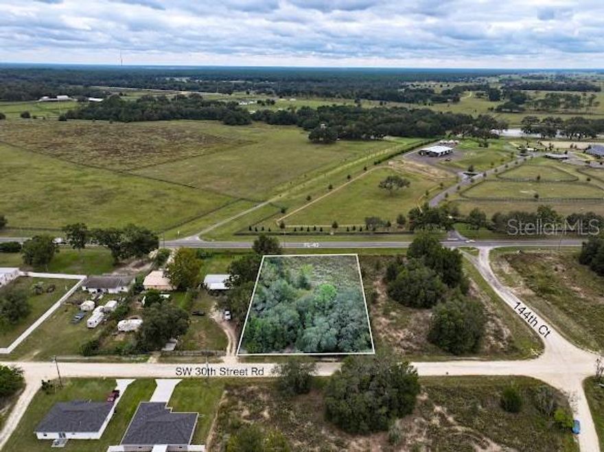 Excellent opportunity in Dunnellon, Florida! This .93-acre (approximately 40,511 sq ft) parcel is ideally located near 14405 W Highway 40 and can be accessed from either Southwest 30th Street Road or directly off W Highway 40. Zoned B-4 (Regional Business), the property allows for a wide variety of commercial uses including retail, office, professional services, recreation, and institutional uses. The zoning is intended for moderate to high-intensity business development serving both local and regional customers.

Located in an X flood zone, no flood insurance is required, offering peace of mind and lower carrying costs for the future owner. Electricity is available at the site, creating a simplified path toward development.

Dunnellon is part of a rapidly growing corridor in southwest Marion County, with strong visibility and easy access to major routes including W Highway 40, County Road 484, and US-41. The surrounding area continues to experience commercial and residential growth, supported by proximity to Ocala, Inverness, and Crystal River. The region’s economy is expanding with new businesses, retail centers, and residential developments emerging along Highway 40, bringing increased traffic and opportunity to this corridor.

This property offers excellent potential for investors, developers, or business owners looking to establish a presence in one of Central Florida’s growth areas. Close to restaurants, grocery stores, banks, medical offices, and everyday conveniences, and approximately 30 minutes to downtown Ocala or the Gulf Coast.