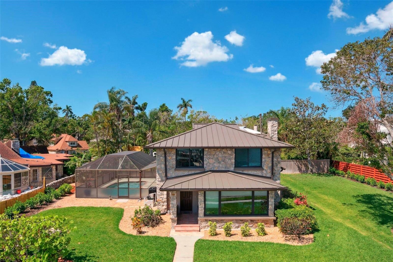 Welcome to this charming residence located on Riverview Blvd in Bradenton, FL. This classic home features spacious living areas filled with natural light, a modern kitchen with updated appliances, and a beautifully landscaped yard appropriate for outdoor entertainment. A wonderful covered lanai with sparkling pool for you to enjoy with recent new landscaping and privacy fence. A spacious dock with lift awaits you for evening wine or a boat ride on the river. An extra large lot lends many possibilities.