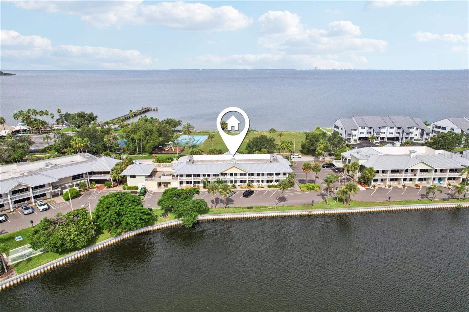 Welcome to your perfect waterfront getaway in the sought-after Little Harbor community! This beautifully updated and fully furnished 1 bedroom, 1 bathroom first-floor condo offers stylish comfort with modern touches throughout. Featuring a cooktop, mini fridge, sleek butcher block countertops, and tile flooring, this unit is truly move-in ready. Step outside to your covered front porch, surrounded by lush landscaping and offering breathtaking views of the tranquil canal. Just a short walk away, enjoy waterfront dining at the popular Sunset Bar & Grill, beach access, a fishing pier, and a variety of water sports. Hooks Restaurant is also nearby, with dock access for boaters. Community amenities abound, including multiple pools, tennis courts, playground, shuffleboard, corn hole, marina, high-and-dry boat storage, Freedom Boat Club access, and some of the area’s top fishing charters. Outdoor grills and scenic bench seating provide the perfect setting for relaxing evenings. Please note: this unit cannot be used as a full-time residence but is ideal as a second home, vacation retreat, or income-generating rental. Don’t miss your chance to own this turnkey waterfront gem in one of the area’s most desirable resort-style communities!