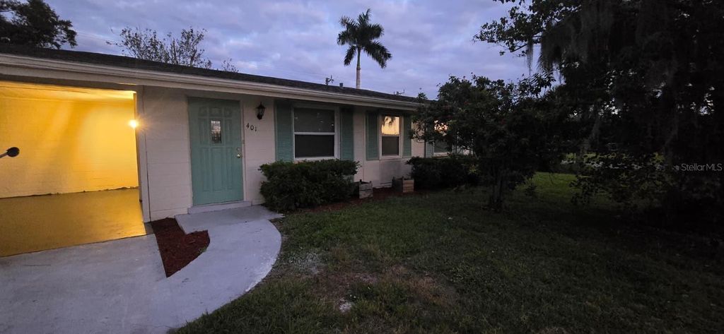 Photo of 401 Skylark Lane NW, Port Charlotte, FL 33952 (MLS # TB8442903)