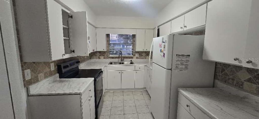 Photo of 401 Skylark Lane NW, Port Charlotte, FL 33952 (MLS # TB8442903)