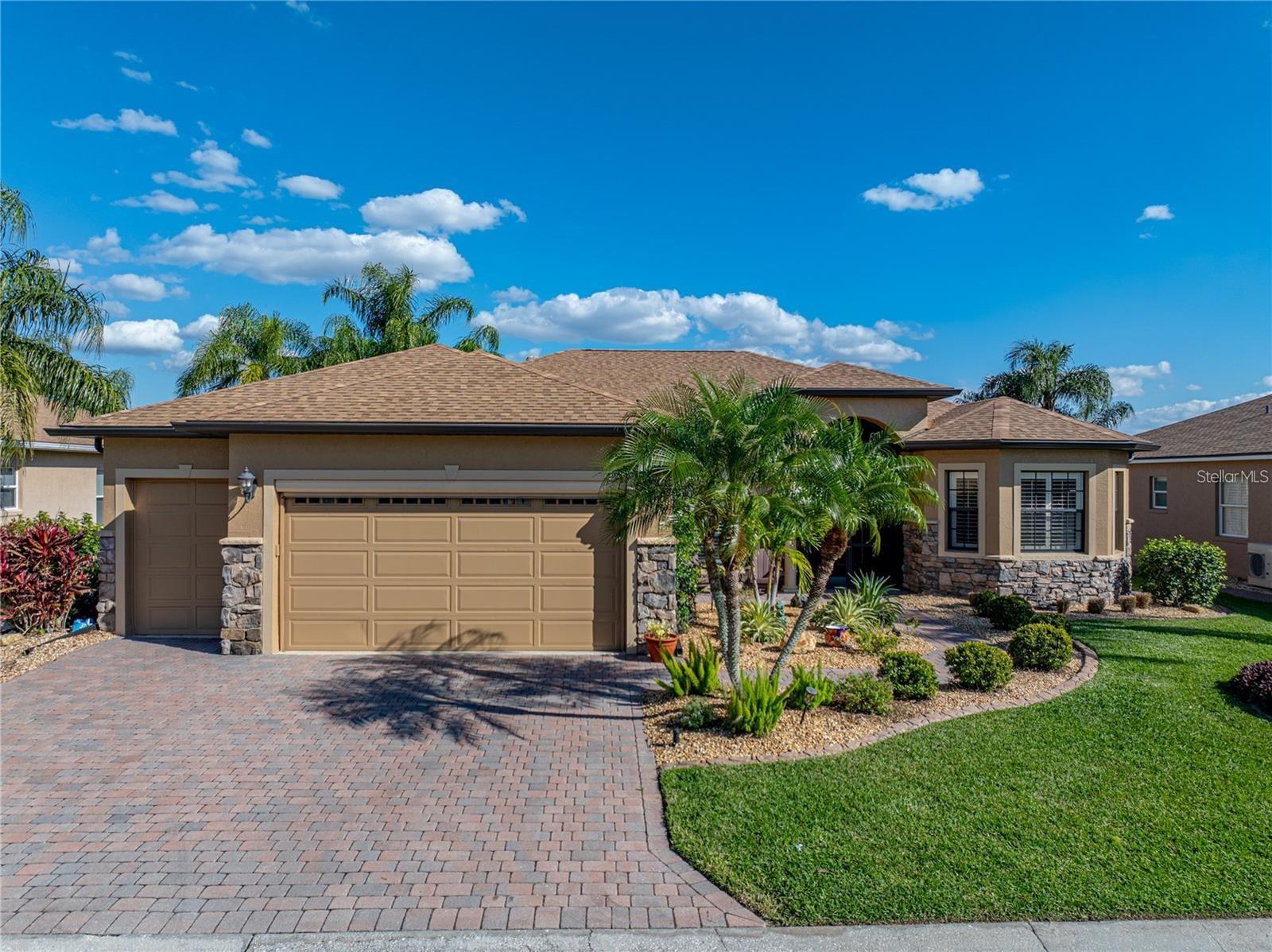 One or more photo(s) has been virtually staged. WATERFRONT CUSTOM St. John floor plan with CDD bond debt PAID IN FULL! A true gem in Lake Ashton!!
Recent Upgrades: Kinetico whole-house water softener, refrigerator (2025), New roof (2024), AC, dishwasher, stove, additional screened room with pavers, and upgraded landscaping (2022).
Experience Florida living at its finest in this beautifully upgraded 3-bedroom + den, 2-bath home, complete with an enclosed Florida room and extended screened lanai.
From the moment you arrive, you’ll notice the attention to detail: custom stacked stone accents, a power screen on the garage door, golf cart garage entrance, upgraded landscaping, a front paver patio, screened entry, and elegant beveled double glass doors.
Inside, round columns frame the dining area, while raised stone archways lead to the kitchen and breakfast nook. The great room features coffered ceilings with recessed lighting, a ceiling fan, and double crown molding that flows throughout the home.
The kitchen boasts a bank of drawers, 42" raised-panel custom cabinets with crown molding, stainless steel appliances, a large prep island with extra storage, granite countertops, pendant lighting, and a breakfast bar.
Wake up to serene views from your primary bedroom, complete with sliding doors to the lanai. The en-suite bath features two walk-in closets, a walk-in shower, double vanities, a soaking tub, and a linen closet.
Enjoy two clubhouses, two 18-hole golf courses, bowling, a movie theatre, craft & card rooms, billiards, pickleball, tennis, bocce, and so much more.