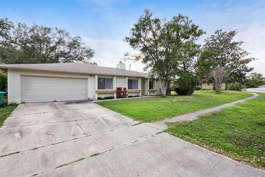 Welcome home to this 4 Bedroom 2 Bath located in the heart Longwood! Featuring a desirable split floorplan with carpet in the living areas and bedrooms. Kitchen has plenty of cabinet space for all those cooking essentials and a window looking out to the backyard letting in natural light! Dining area is just off the kitchen with sliders leading to back yard. Sunken living room with wood burning fireplace to enjoy gatherings. Full size washer and dryer connections in 2 car garage. Close to downtown Longwood, shopping, dining making this very convenient place to live. Make this your home today! Lease option, owner financing available, will also consider trades for real estate up or down