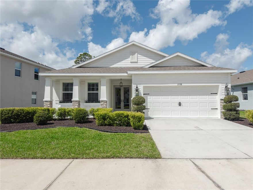Welcome to this beautifully upgraded 3-bedroom, 2-bathroom home in the highly desirable Bay Landings community of Lakewood Ranch. Thoughtfully designed and meticulously maintained, this residence showcases a variety of custom touches and high-end upgrades throughout. A spacious and welcoming front porch creates a charming first impression and offers the perfect place to relax and enjoy the peaceful neighborhood setting.
Inside, the open-concept layout creates a bright and inviting living space that flows effortlessly from the kitchen to the dining and living areas—ideal for both everyday living and entertaining. Positioned on a generous pie-shaped lot, the home enjoys peaceful conservation views that provide privacy and a beautiful natural backdrop. The home has also been freshly painted on both the interior and exterior, giving it a crisp, updated feel from the moment you arrive.
Natural light fills the main living space thanks to two skylights installed just two years ago, enhancing the bright and airy atmosphere. The kitchen is a true centerpiece, featuring custom cabinetry, quartz countertops, and a stunning custom double-fan range hood that blends style with functionality. Unique hardware sourced and shipped directly from Morocco adds a distinctive touch that sets this kitchen apart. Both bathrooms continue the theme of quality finishes with granite countertops and upgraded hardware.
All three bedrooms feature engineered hardwood flooring for warmth and durability, and each bedroom is equipped with ethernet wiring for reliable connectivity. The spacious primary suite offers a beautiful trey ceiling that adds architectural character, along with a customized walk-in closet system designed with extensive storage and organization in mind. The primary bathroom provides a relaxing retreat with a walk-in shower as well as a separate stand-alone soaking tub.
One of the only homes in the neighborhood featuring French doors, the elegant access to the outdoor space was installed by Anderson Windows & Doors, adding both quality craftsmanship and style. The garage has also been upgraded with a sleek epoxy floor that is less than a year old.
Step outside to enjoy the expansive backyard, where clusia plants line the perimeter and can grow up to 30 feet tall, creating a natural privacy wall over time. This home offers the perfect blend of thoughtful upgrades, comfort, and location. Just minutes from Waterside, incredible restaurants, the shops at UTC, and some of America’s most beautiful Gulf Coast beaches, you’ll enjoy convenient access to everything that makes the Lakewood Ranch lifestyle so desirable.