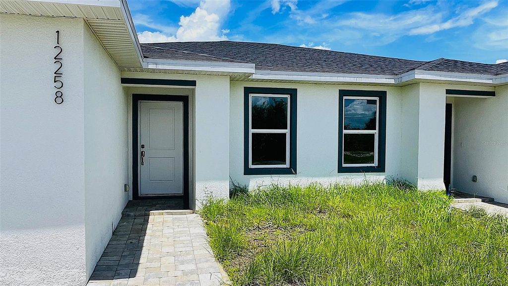 Photo of 12258 Henley Avenue #A, Port Charlotte, FL 33981 (MLS # C7514300)