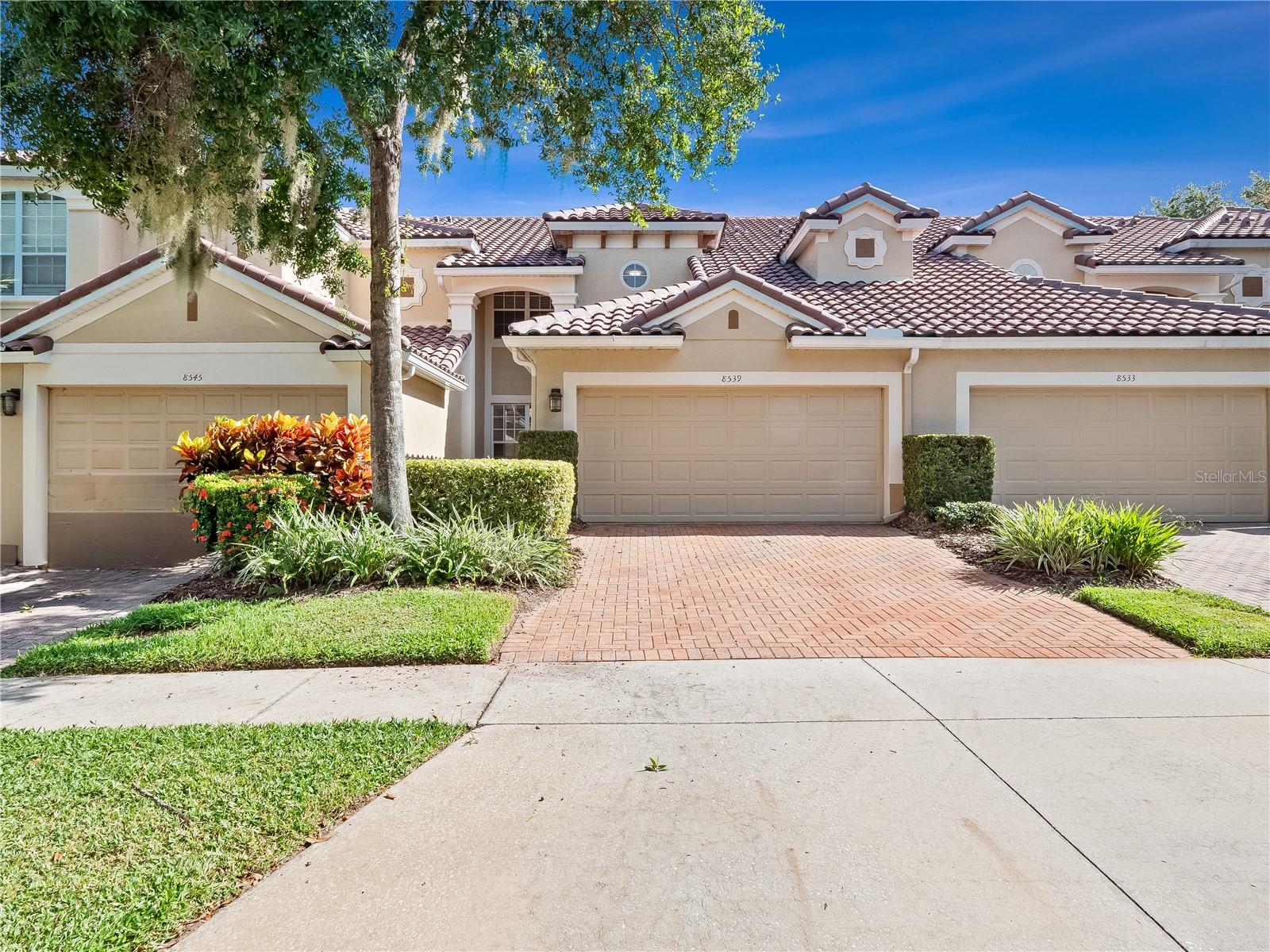 Welcome to this beautiful 3-bedroom, 2.5-bathroom townhome located in the exclusive gated community of Vizcaya in Dr. Phillips. Offering over 2,000 sq. ft. of living space, this home has been freshly painted inside and updated with new light fixtures—move-in ready for its next resident.
The first floor features a bright, open floor plan with plenty of space for both formal dining and comfortable living. Two sets of patio doors open to a large, covered, and screened lanai, perfect for year-round enjoyment. The kitchen boasts ample cabinet space, granite countertops, a generous pantry, and convenient access to the laundry room and attached 2-car garage.
Upstairs, the spacious primary suite offers a huge walk-in closet and a spa-like bathroom complete with dual vanities, a soaking tub, and a walk-in shower. Two additional well-sized bedrooms share a full hallway bath with single vanity and a tub/shower combo.
Vizcaya's prime location means you can walk to Restaurant Row, with world-class dining just steps away. The community offers resort-style amenities including pools, tennis courts, pickleball courts, and a fitness center.
