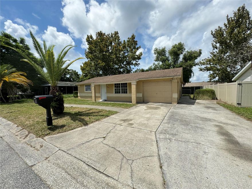 ATTENTION RENTERS: AVAILABLE THE FIRST WEEK OF OCTOBER as it is currently occupied by another tenant until the end of the month. Check out this 3 BEDROOM, 2 BATHROOM and 1 Car Garage and FENCED in backyard home in a great location. ALL TILE FLOORING and no carpeting throughout the home. Large open living room with a kitchen as you enter. APPLIANCES INCLUDE: STOVE, REFRIGERATOR, & DISHWASHER. This recently updated home has new doors, painting, a new garage door and PLENTY OF NATURAL LIGHT throughout the home. The MASTER BEDROOM is separate from the rest of the home for privacy and features a private master bathroom with a large soaker garden tub with access to the backyard from a private entry door. The other 2 bedrooms are located on the opposite side of the house with all new ceiling fans installed. AC is 3 years old. WASHER & DRYER ARE NOT INCLUDED. Only one block from HWY 54 and close to US 19. Only 25 minutes to Tarpon Spring Beach and Fred Howard Park. PETS ALLOWED with a $250 non-refundable pet fee per pet. 12 month lease required. TENANT RESPONSIBLE FOR ALL UTILITIES include water, electricity, cable and trash. SECURITY DEPOSIT EQUAL TO THE FIRST MONTH RENT AMOUNT. QUALIFICATIONS: All adults must have a credit score of 620 or higher, make an income of 2.5x the gross monthly rent amount. All background checks will be conducted including income verification and previous rental history.