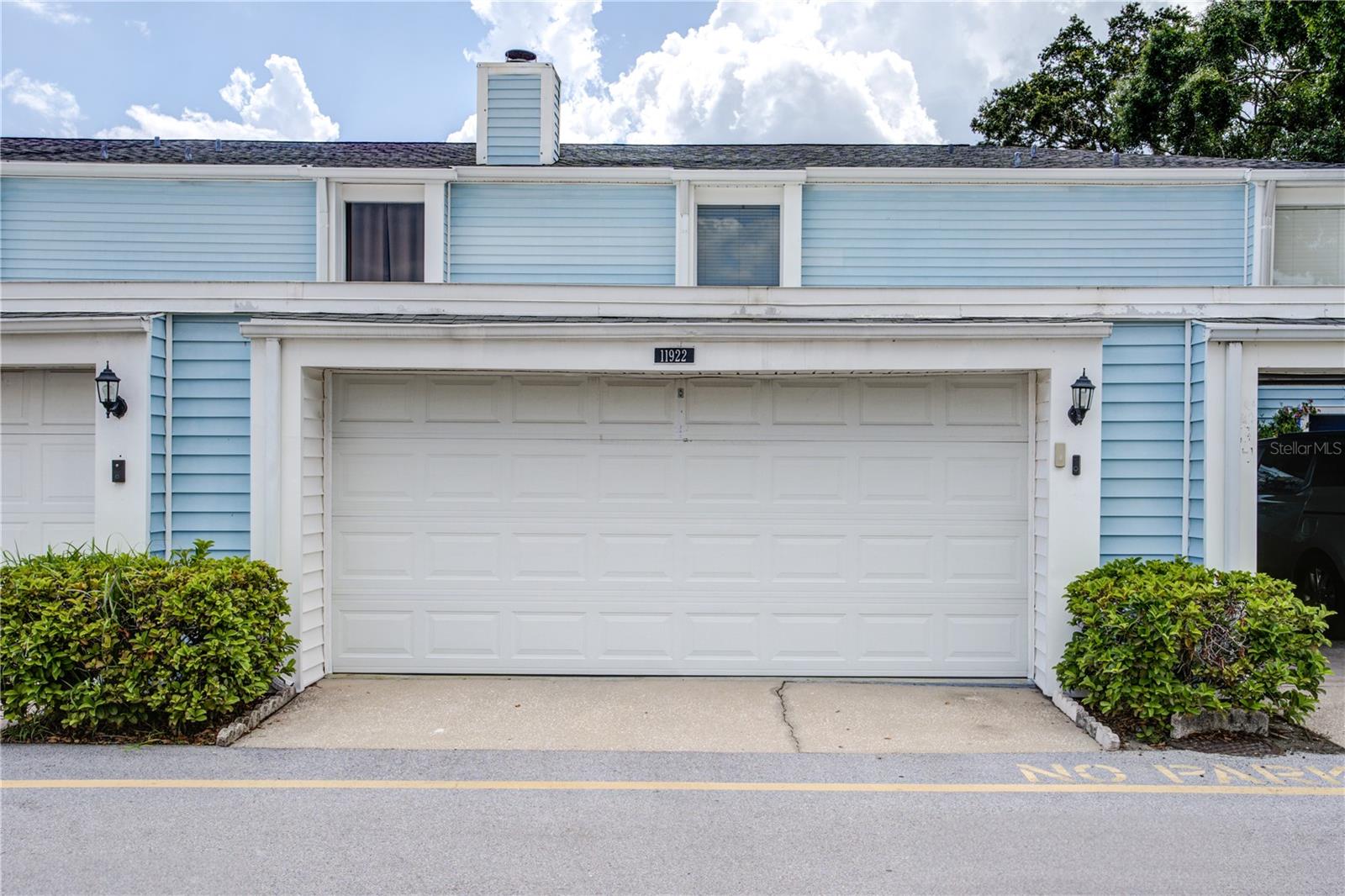 This beautifully updated townhome sits in one of Tampa’s most desirable locations, just minutes from Citrus Park Mall, top-rated restaurants, shopping, and the scenic Upper Tampa Bay Trail. This home offers the perfect balance of convenience and tranquility. Inside, you’ll find elegant luxury vinyl plank flooring throughout and an inviting open-concept living space anchored by a stunning stone fireplace. The spacious living room flows seamlessly into the dining area and kitchen, creating a perfect layout for entertaining. The kitchen is a chef’s dream, featuring gleaming granite countertops, solid wood cabinetry, stainless steel appliances, a tiled backsplash, and a closet pantry all within view of the action, whether it is in the dining room, living room, or out in the back lanai. A breakfast bar adds additional seating and convenience. Just off the kitchen, sliding glass doors open to a massive screened-in lanai and a private, fenced backyard ideal for relaxing or hosting gatherings. Upstairs, you’ll find two generously sized bedrooms, each with large closets. The primary suite includes a private, updated bath, while a second full bath, also recently updated, which the second bedroom, which boasts his and hers closets.
Thoughtful upgrades are found throughout, including modern light fixtures, a solid wood front door, a charming stained glass accent window, and framed bathroom mirrors. The entire interior has been freshly painted with new floors and baseboards. Additional highlights include an oversized two-car garage with an epoxy-painted floor, ample guest parking just steps from your door, and access to community amenities including a walking trail with pet stations, a grassy park area with benches and BBQ grills, and a fenced pool area with bathrooms, picnic tables, and cooking stations. Don’t miss your chance to own this beautiful home in the heart of Tampa.