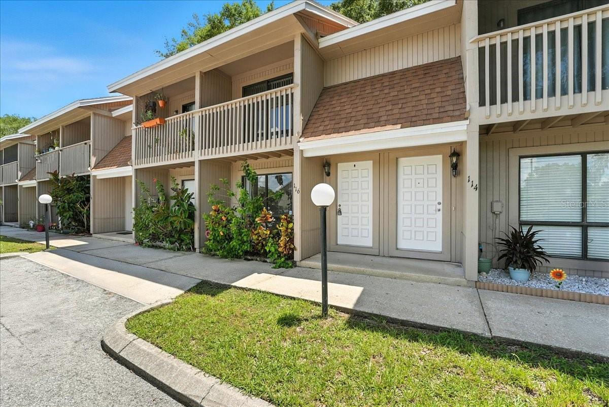 Experience the perfect blend of comfort and convenience at 752 Howland Lane Unit 116, a charming 2 bedroom, 1.5 bathroom townhome in Altamonte Springs’ desirable Wycoff Park community. The inviting living area opens seamlessly to the lovely kitchen and dining area. Tiled on the first floor, the layout flows naturally into a private fenced courtyard, your ideal spot for relaxing or hosting guests. Additional features include a convenient half bathroom and large laundry room with storage space. Upstairs, vaulted ceilings enhance the airy feel of two well-appointed bedrooms. The primary suite impresses with dual closets, sliding doors that open to a private balcony, and an updated full bathroom in the hallway. Just off Maitland Avenue, this townhome offers effortless access to a variety of shops and restaurants, the Altamonte Mall, and major commuter routes including I-4 and the SunRail.