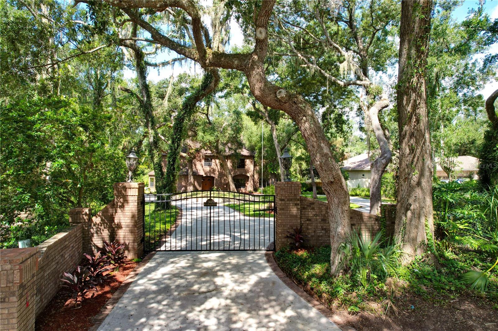 What are you waiting for? This is NOT your average cookie-cutter home and features 4 + garage ( 1000 + sq ft) with a mechanic's pit, Newer AC's (2022), roof ( 2013) , and a walking trail back to the Alafia River.
4 bedrooms, 3 full and 2 half baths, Indoor Pool/Spa, Elevator, 2 Fireplaces, Wet Bar, and Gated Circular Driveway nestled at the end of a quiet cul-de-sac on over an acre with 138 feet of Alafia River frontage, a Private Dock, and Riverside Deck.
From the moment you step through the solid oak double doors into the two-story marble foyer, you're enveloped in rich craftsmanship and architecture. Intricate solid oak detailing, 9’ Ceilings, 5.5” Baseboards and luxury finishes greet you at every turn.
The living room offers tranquil views of the manicured, gated entry—framed by grand windows that flood the space with natural light. Across the foyer, the dining room is adorned with a custom-built oak china cabinet, perfect for hosting intimate dinners. Steps away is the heart of the home, a chef’s dream kitchen, equipped with a Sub-Zero refrigerator and freezer, induction cooktop with anti-scratch matte glass, granite countertops, a center island, walk-in pantry, and a spacious eat-in area. The kitchen was thoughtfully designed to inspire culinary creativity and seamless entertaining.
The family room is equally impressive, featuring a cozy wood burning fireplace, custom-built oak shelves and cabinetry, a wet bar with ice maker, sink, frig, built-in blender and a surround sound system to set the tone for relaxation. Two 3-panel sliding glass pocket doors vanish to reveal the stunning enclosed Atrium with (15x30) Indoor Pool & Spa—both heated by solar. This indoor oasis is set under a two-story vaulted ceiling with skylights and includes a DCS outdoor kitchen, complete with gas grill, Thermador hood, refrigerator, and sink and access to a full bathroom making this area ideal for year-round entertaining.
Ascend by elevator or stair to the spacious owner’s suite, a 17x20 retreat with dual cedar-lined walk-in closets and a European spa-style bath, featuring dual vanities with sinks and a central walk-in shower, toilet, urinal & bidet.
Adjoining the suite is a spacious flex room with its own fireplace—ideal as a private lounge, nursery, or 4th bedroom. Glass doors lead to a balcony overlooking the pool/spa atrium below.
A second bedroom suite includes dual built-in closets, a private en-suite bath with dual vanities with sinks, and a step-in shower.
Remote workers and Book lovers alike will appreciate the 30x14 oak-lined library or home office, featuring wall-to-wall built-ins, custom cabinetry and desk—a warm, inviting space for work or relaxation.
An upstairs laundry room with utility sink and a fourth bedroom or versatile flex room round out the second floor.
, Modern Light Fixtures & Granite Countertops, Updated Pool Pump & Upgraded Water Heaters(2)
Meander down a winding pathway that leads you to the tranquil riverfront, where you can enjoy peaceful mornings or canoe/kayak/paddleboard from your private dock or simply sit and enjoy the quiet sounds of nature.
Don’t miss this once-in-a-lifetime opportunity to own a secluded riverfront residence with every imaginable amenity, designed for those who demand the very best in life.
Schedule your private tour today.