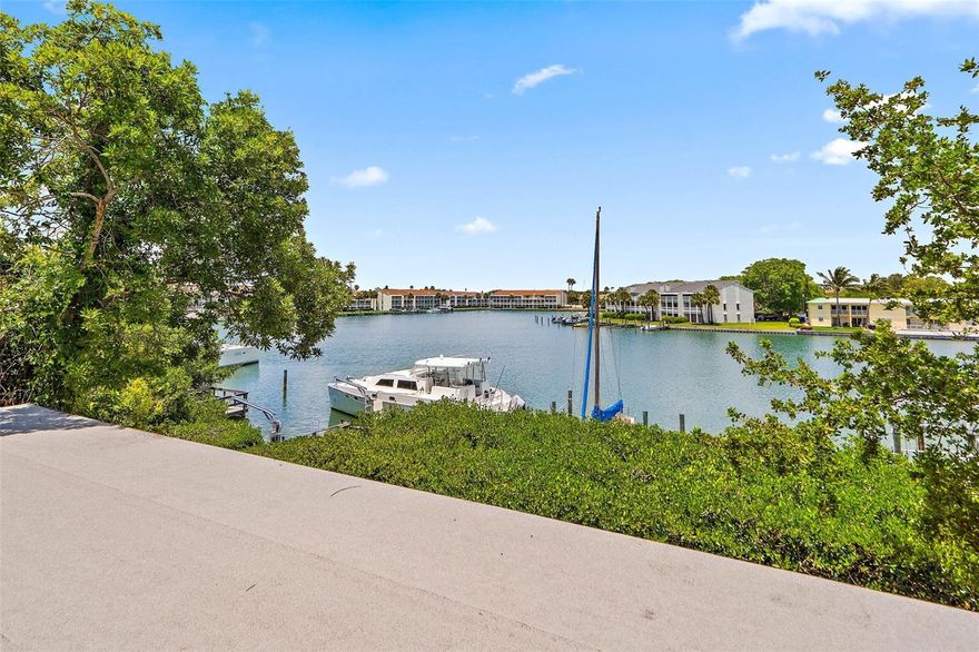 HURRY on this one - WHAT A COMBO - a "home for you, AND a home for your boat" – an elevated home … located basically ONE BLOCK FROM THE BEACH; and offering IMMEDIATE Gulf and Intra-Coastal Waterway Access via John's Pass for all of you boaters; sitting on good, protected boating water for most sailboats, trawlers, etc....In addition to quick boating access to John's Pass, you are an EZ walk to all of the fun and entertainment of John's Pass Village .... HELLLO, “Permanent Vacation”! … Two living levels, PLUS a Dock with TWO Boat Slips, AND ALSO a HUGE Carport and Storage area on Ground Level, PLUS a PRIVATE, Pavered Patio-Backyard area for outdoor entertaining … PRIVACY provided by the Mature Mangroves that also help protect your seawall … Your 1st Living Level has a LARGE Enclosed Porch currently used as actually TWO Home Office areas (with great Water VIEWS; and a potential 4th Br here) … also on 1st floor is the Dining and Living Areas boasting SOARING, Vaulted Ceilings with a Wood Burning FIREPLACE … this (or the adjacent DEN) are perfect places to cozy up with a good book, and you’ll have lots of space to house your library, given the numerous book shelves! … The Guest Bath for first floor is off the Den…. The compact and efficient kitchen has a built-in “breakfast booth” which gets lots of use – and the washer– dryer are conveniently located here …All three bedrooms are upstairs for privacy, have the HIGH ceilings for spacious feel and the "Primary" Bedroom directly overlooks the water ... This entire home boasts a very "efficient use of space" and nearly 1700 of air-conditioned living area – with over 2500 Total Square Feet … This one owner 1982-built home is PRICED TO SELL (and to allow for some additional updating and attention to details) … it is the lowest priced waterfront home on Treasure Island today and represents a solid VALUE in Today’s Treasure Island Waterfront Home market …  being elevated will give some peace of mind and owners say their flood ins policy is now just a bit over $600/YEAR and is likely assumable … if you’ve shopped around, you’ll agree that it’s doubtful you can duplicate THAT, today! … IF keeping your boat in back yard, quick Gulf or Intra-Coastal access, and / or  walking to the beach are important to you - (at an affordable price) - Don’t delay….CALL TODAY