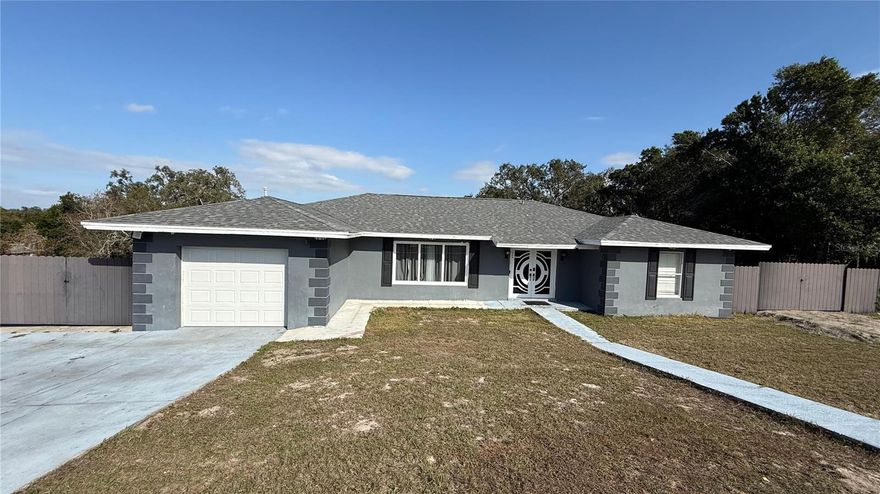 A gorgeous home with 5 bedrooms and 2 full bathrooms, beautiful and inviting and sitting on 0.6 acre of land, offers all modern conveniences and comfort in a quiet, almost countryside, location. Carefully crafted interior with plenty of natural light; modern bathrooms; worry-free ceramic tile floors throughout; massive island/breakfast bar in the spacious kitchen; fully-fenced back yard; and an absolutely fantastic in-ground swimming pool - screened in and with plenty of additional roof-covered space for entertainment!