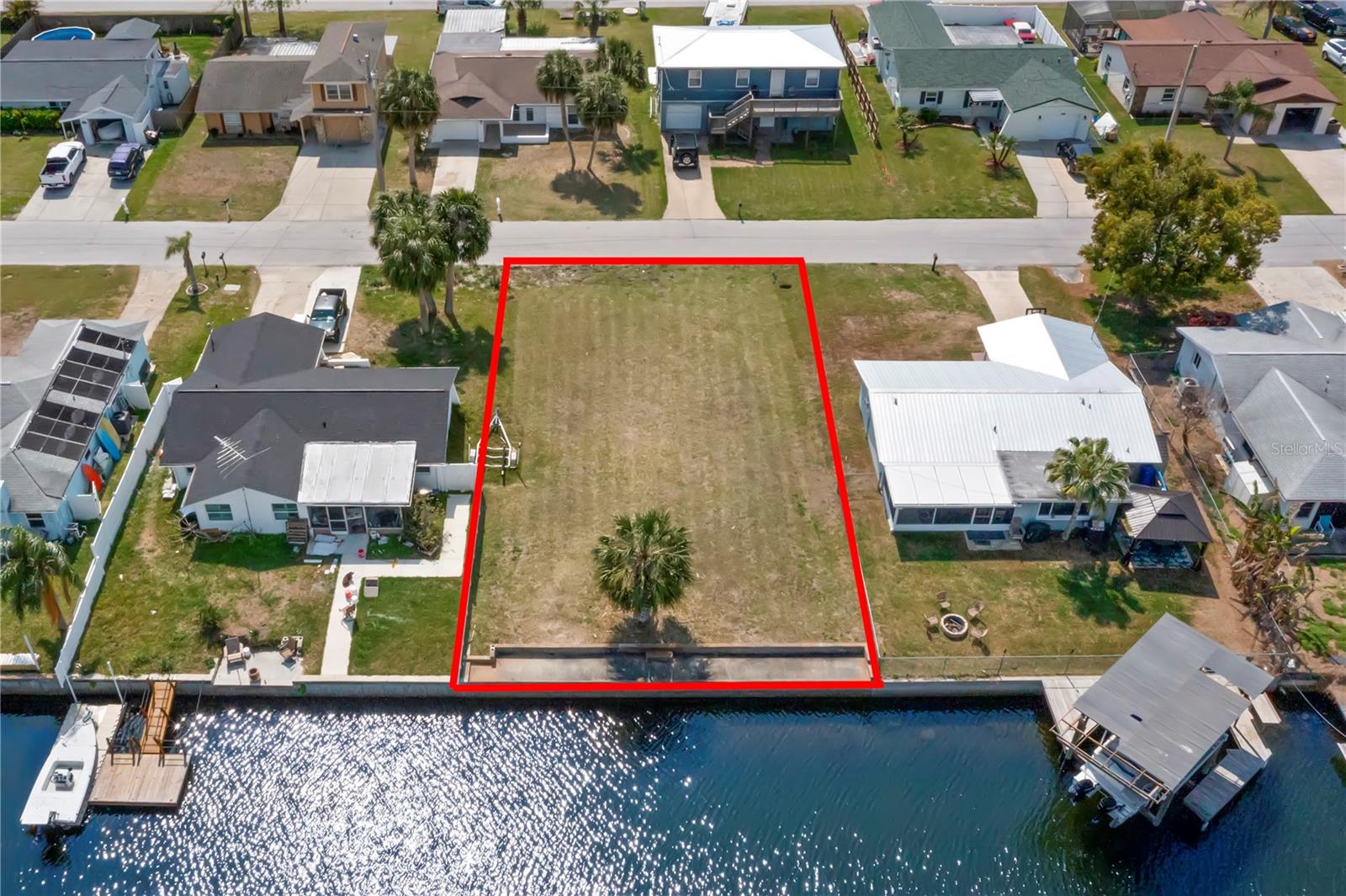 WATERFRONT WITH GULF-ACCESS Lot in the BOATING COMMUNITY of SEA PINES!
This 6,000 SF buildable waterfront lot in Hudson is a boater’s dream! Enjoy DIRECT ACCESS TO THE GULF OF MEXICO WITHIN MINUTES—NO BRIDGES! The lot is COMPLETELY CLEARED, CAPPED, and SEA-WALLED, making it ready for your custom dream home and private boat dock.
Sea Pines is a single-family home community—NO MOBILE HOMES OR TRAILERS—where all the streets are named after boat brands. The community boasts its own Coast Guard-maintained access channel for smooth boating year-round. The saltwater canal depth ranges from approximately 5-6 feet at mid-tide and 4-5 feet at low tide, making it ideal for a variety of boats, sailboats, and jet skis.
Surrounded by serene saltwater marshlands, Sea Pines is a nature lover’s paradise. Wildlife sightings include Florida Panthers, Black Bears, Bald Eagles, deer, and a variety of coastal birds. The canals are rich with REDFISH and SNOOK, and you may even spot DOLPHINS or MANATEES from your own backyard!
Despite its SECLUDED FEEL, this property is just 5-10 MINUTES FROM CONVENIENCES such as grocery stores, restaurants, shopping, golf, parks, hospitals, and more. Nearby attractions include:
1) SUNWEST PARK – A freshwater spring beach with an Aqua Park, Floating Jungle Ropes Course, Wake Park, and more!
2) WEEKI WACHEE SPRINGS STATE PARK – Famous for its crystal-clear waters and mermaid shows.
3) ARIPEKA STONE CRAB COMPANY – A local hidden gem for fresh seafood!
NO HOA! However, the community has a volunteer-run Civic Association with a $50 ANNUAL FEE for clubhouse and common areas. The optional COMMUNITY BOAT RAMP is available for an additional $40 per year.
This lot features public utilities—NO SEPTIC NEEDED! While there are deed restrictions, they have aged out and are no longer enforceable (buyers should verify all building codes with the county).
Come experience true waterfront living! Fish from your backyard, take your boat out for a sunset cruise, and enjoy the best of coastal Florida. Ready to build your dream home? This lot is ready for you!