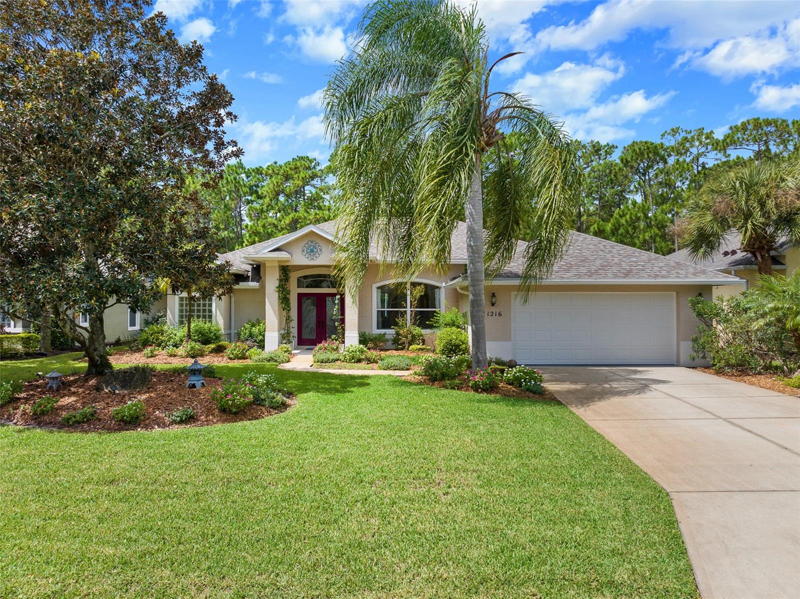 Welcome to this beautifully updated residence at 1216 Hampstead Lane, offering three bedrooms plus an office, a private pool with spa, and an abundance of recent renovations that make this home completely move-in ready. From the moment you arrive, you are greeted by lush floral landscaping, a charming front porch, brand new gutters, and a double front door entry that sets the tone for the elegance inside. The remodeled kitchen is truly a showstopper, featuring Cambria quartz countertops, all-new soft-close dovetail cabinetry, a solid stone sink, a stylish tile backsplash, Samsung Series appliances, a pantry closet, and an oversized walk-in pantry. The adjacent dining area is filled with natural light from large windows that overlook the sparkling pool, while the spacious family room boasts a coffered ceiling, new carpet, and triple sliders that seamlessly extend your living space out to the screened lanai. The owner's suite offers a private retreat with plush carpet, a versatile extended area ideal for a sitting nook or office space, and peaceful views of the outdoors. The master bath includes dual sinks, a walk-in tiled shower, and a soaking tub. A dedicated office with double-door entry and a big front-facing window provides the perfect work-from-home environment. Two additional bedrooms, both with updated carpet, offer comfort and flexibility for family or guests. Outside, you'll find a resurfaced pool and spa surrounded by lush privacy landscaping, natural palms, and a deep preserve backdrop that creates a serene and secluded setting. The lanai has been completely rescreened, making this the perfect place to relax or entertain in year-round comfort. Every detail of this home has been meticulously cared for, with major improvements that include a new roof, new HVAC with advanced filtration, a new water heater, new hurricane-proof garage door and opener, new high-grade cork-backed laminate flooring, fresh carpet, updated light fixtures, new ceiling fans, bathroom exhaust fans, two new toilets with bidets, and fresh paint both inside and out. Additional updates include pool resurfacing with new drains and lights, a fully refurbished sprinkler and drainage system, reworked landscaping, and a recently completed four-point inspection that ensures peace of mind. The garage provides extended depth with space for a golf cart, while the laundry room offers additional cabinets, a sink, and extra storage. All located in gated, golf cart friendly community of Plantation Bay Golf and Country Club. Optional memberships available to include 45 holes of private golf, 10 pickleball courts, 9 tennis courts, new 30-million-dollar Founders clubhouse, additional Prestwick Clubhouse, fitness/spa center, bocce ball, clubhouse with cabana bar and grill, and full activities calendar. Buyers of this home are to receive a substantial discount on the initiation fee at the club. Ask the listing agent for details. With excellent natural light throughout, a long list of renovations, and a tranquil preserve setting, this home blends style, comfort, and functionality in the highly sought-after Plantation Bay community.