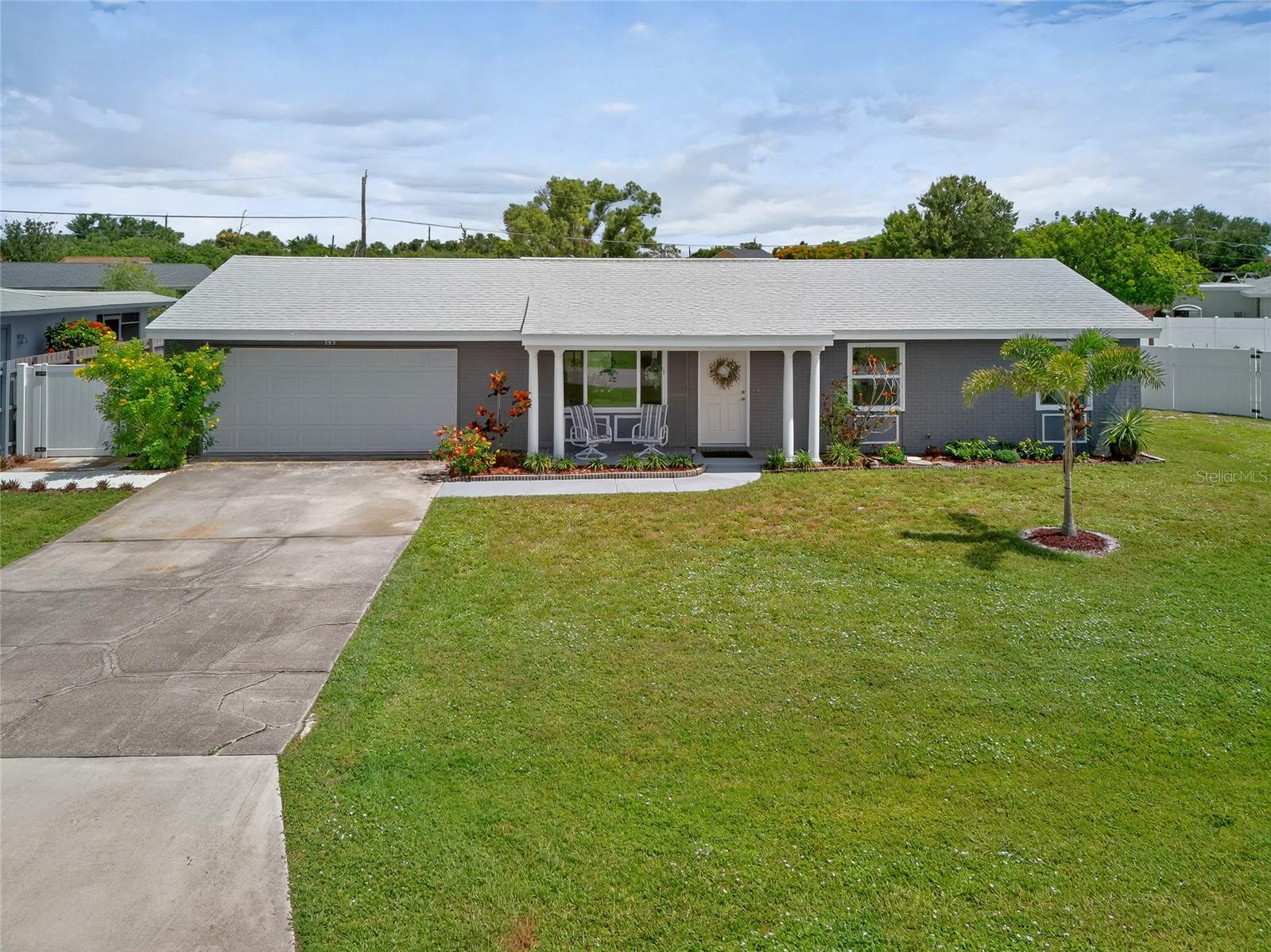 BONUS SUITE! UPDATED 2 BEDROOM, 2 BATH, CONVERTED GARAGE HOME ON OVERSIZED LOT IN PORT CHARLOTTE! For peace of mind this home offers new impact windows and doors plus new roof installed in 2023. Inviting open floor plan features living, dining and kitchen with large fenced in back yard perfect for outdoor activities and entertaining. Step inside where you will find ample natural light, tray ceilings, luxury vinyl/ tile flooring and many updates throughout. Beautiful kitchen offers modern two-toned cabinetry with rollout drawers, quartz countertops, tile backsplash, and island overlooking dining and family room. Two nicely sized bedrooms with neutral décor creating a bright and airy ambiance with two baths in the main part of the home. The bonus suite is a true retreat, which includes a converted garage in 2022 as a studio apartment or mother-n-law suite featuring a separate private entrance and patio, kitchenette, and full bath, perfect for guests or rental income. Step outside to a covered and screened lanai plus plenty of room for a pool. Additional highlights include inside laundry, new AC system 2023, 14 sear heat pump with ultraviolet light, added 16-inch insulation in attic, two sheds for extra storage, and large side gate entry to expansive backyard. Meticulously maintained with pride in ownership. In a friendly and quiet neighborhood located near US-41 with restaurants, shops, schools, hospitals and outdoor activities. About 20 minutes to downtown historic Punta Gorda with world-class fishing, boating, beautiful parks, community events and entertainment. Don’t miss this opportunity! Schedule your private showing today!