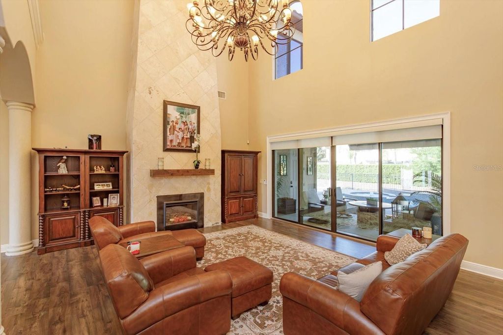 Photo of 5719 Emerson Pointe Way, Orlando, FL 32819 (MLS # O6397588)