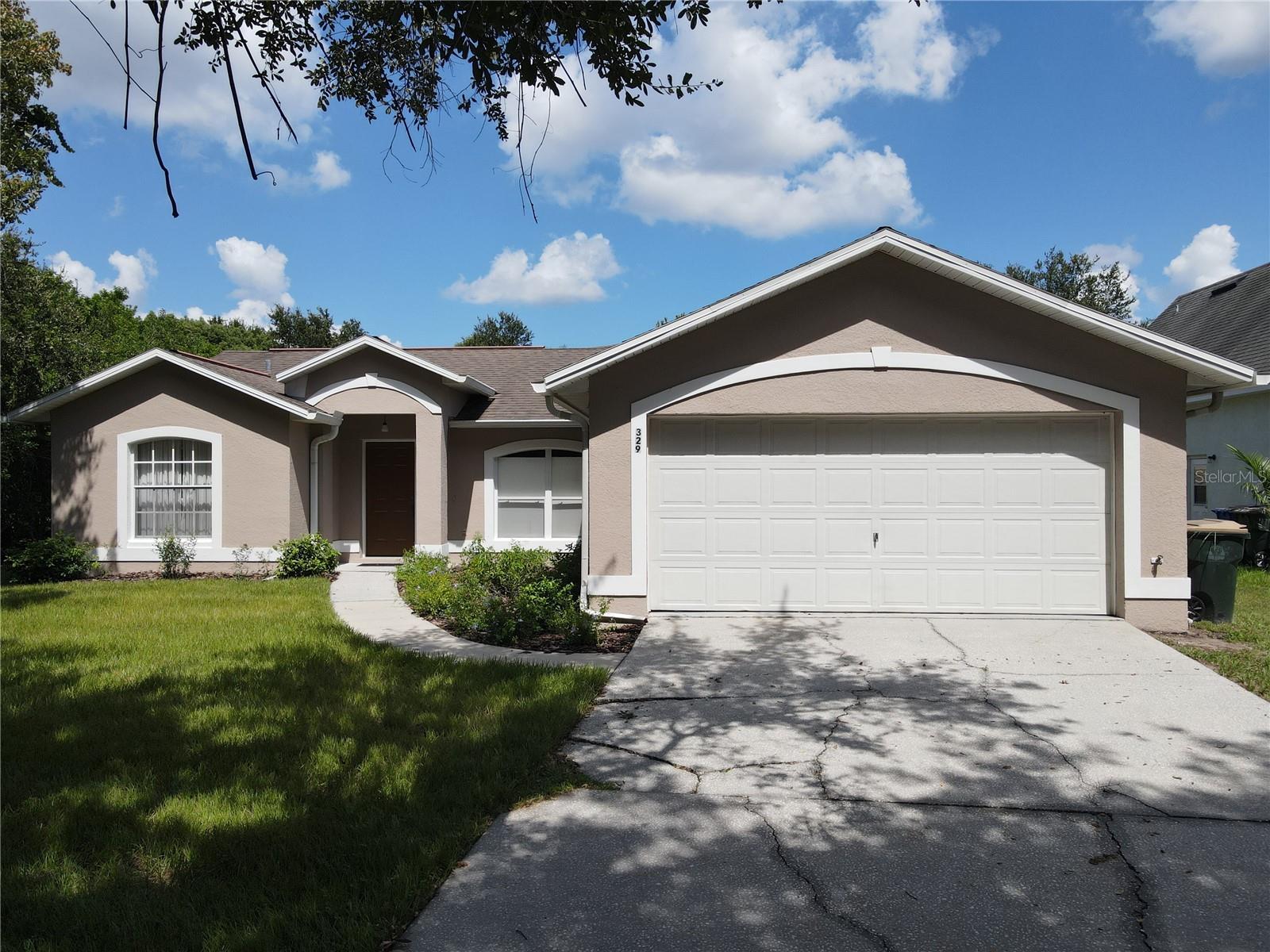 Check out this 4-BR 3-full-BA home on .77 acres with no HOA! This home is move-in ready. There is a 560 sf metal building at the back of the property, and you can drive around the house on either side to get to the back yard. This home has an open floor plan, so enter the large living room and see the dining area and kitchen to the right. There are lots of maple cabinets, a high breakfast bar, and a double-door closet pantry. The primary suite has a walk-in closet and private bath with glass-door tiled shower and a long vanity with dual sinks. The second bedroom has double closets and a full bath adjacent. This bath has a door leading to the back yard. Bedrooms 3 and 4 also have double closets and share the 3rd full bath with tub/shower. From the kitchen see the family room, a multi-purpose area, now being used as an exercise room. There are French doors out to the small lanai, perfect for the barbecue. Out behind the house is a huge back yard with a 28x20 shed, great for storage or workshop, she-shed or man-cave. Roll-up doors on both ends plus a regular door. The home has been freshly painted, inside and out, and this home and yard are in very well-maintained condition. Roof was replaced in 2014. The home is on city water and septic, and the drainfield was replaced in 2022. Don’t forget, three-quarters of an acre, no HOA, huge storage shed. Located on a one-way street close to Narcoossee Rd and Hwy 192. Make an appointment today!