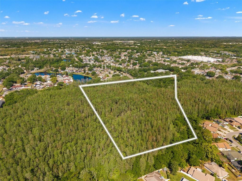 Photo of 12591 Henderson Road, Tampa, FL 33619 (MLS # TB8499977)