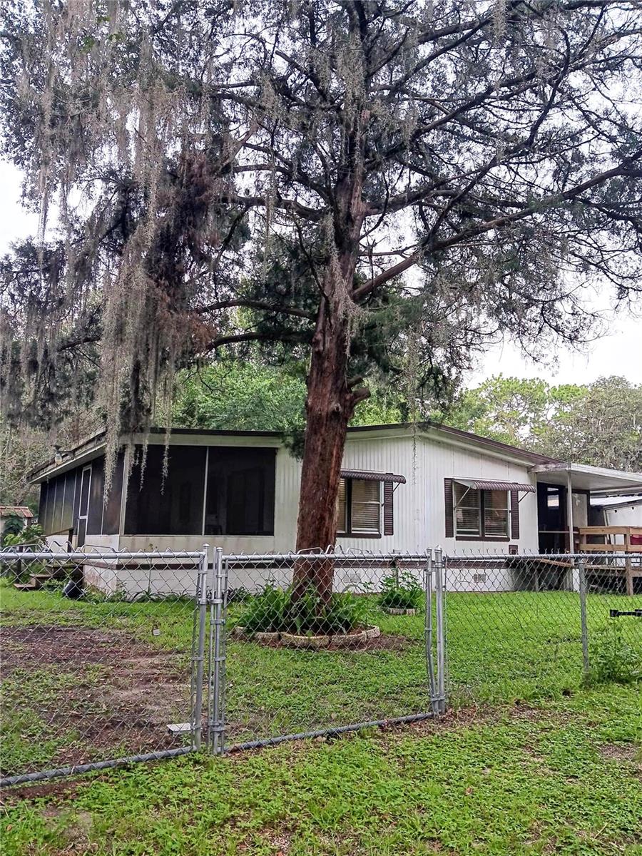 Bank Finacing or Owner Finacing offfered. Bring your RV, Boat, Trailors and more as there is plenty of room on this property. With a public boat ramp just (2) blocks away, enjoy fishing or a day trip on the lake. Dues for boat ramp use is only $30/yr. This corner lot 2/2 has a ramp and/or steps to access entrance. Solid cement breezy screened Florida room provides a very spacious area. The entrance room can become an office or breakfast area or indoor garden. This 2/2 double wide sits a nice corner lot offering a nice space in the yard. Come check it out! Additional photos to be posted by August 5th, 2025