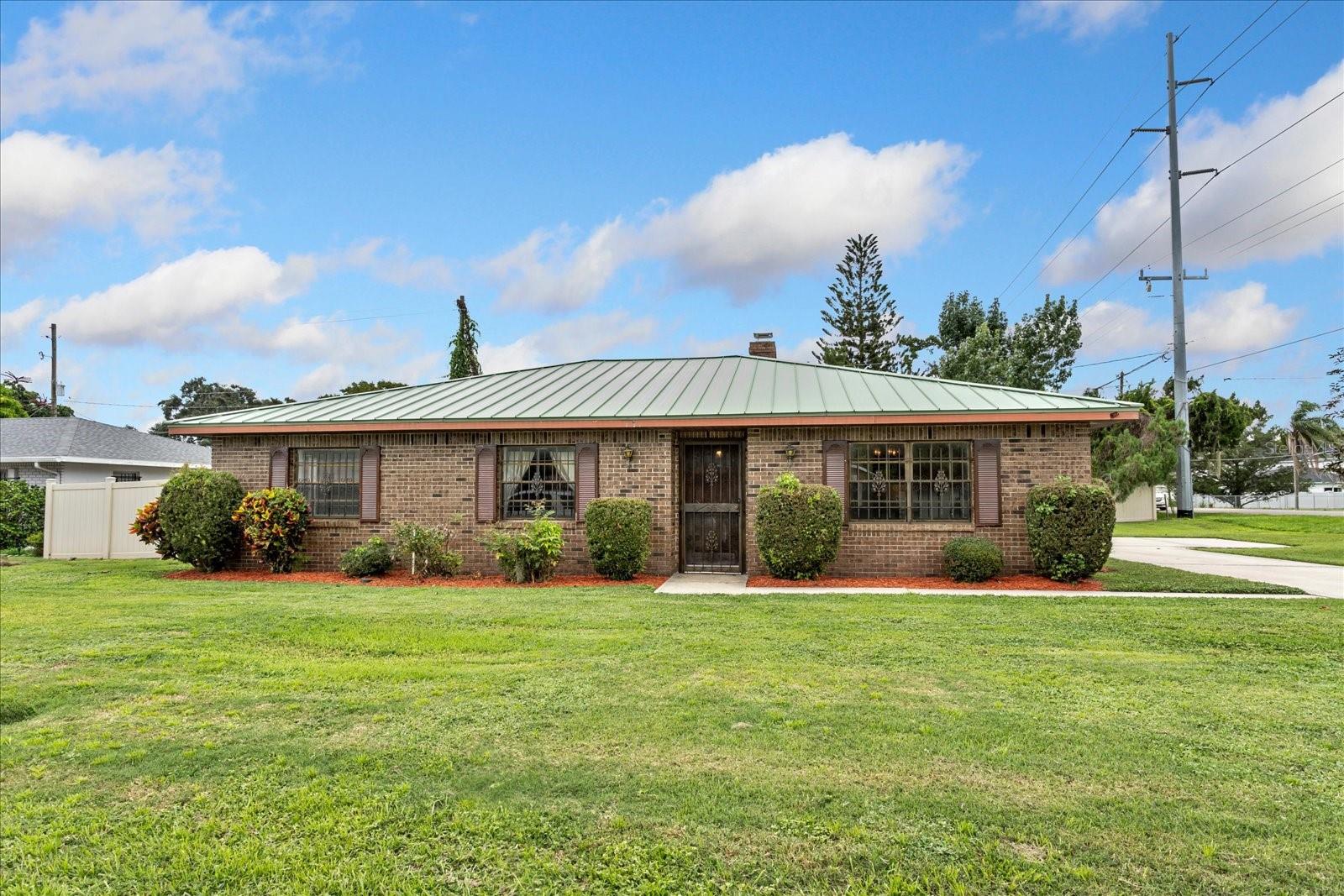 This Three Bedroom, two bath home has large rooms, an oversized 2 car garage with openers, an awesome metal roof, and new vinyl fencing around the large back yard. The Florida Room has a vaulted ceiling and lots of windows and will make you think you are on vacation at a cabin or a ski-resort! This is a solid block home on almost a quarter acre and is convenient to Downtown Orlando, Great Transportation Corridors, and the Parks. My favorite nearby institution is Costco! With this home you will have plenty of storage space to keep all your Costco purchases! Come check this one out today.