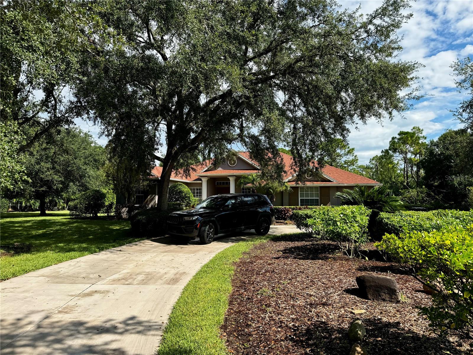 Welcome to this stunning light-filled haven nestled on a sprawling one-acre lot in the highly sought-after Panther Ridge community of Bradenton! This exceptional property boasts four spacious bedrooms, a cozy den, and three bathrooms, offering great space for relaxation and entertainment. Recent upgrades abound, including a brand-new roof (2022), fresh interior paint, and modernized HVAC, water heater, pool heater, and pool screen (all 2022). The sleek kitchen features brand-new appliances, perfect for culinary enthusiasts. With its immaculate condition and thoughtful updates, this home is truly move-in ready. Imagine effortlessly transferring your belongings and starting your new life in this beautiful setting. Additional highlights include a spacious three-car garage and a picturesque circular driveway, perfect for showcasing your vehicles or creating a warm and inviting entrance. Don't miss this incredible opportunity to own a piece of paradise in Panther Ridge. Schedule a viewing today and make this incredible property yours! SHORT TERM OWNER FINANCING OFFERED