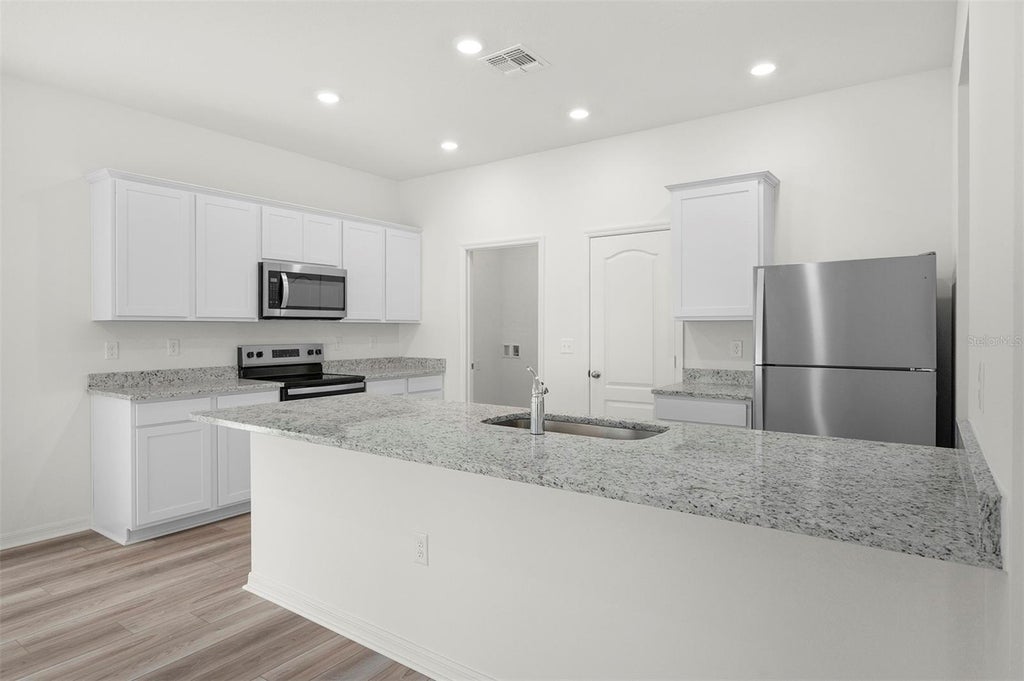 Photo of 13234 Tula Loop, Astatula, FL 34705 (MLS # TB8550965)