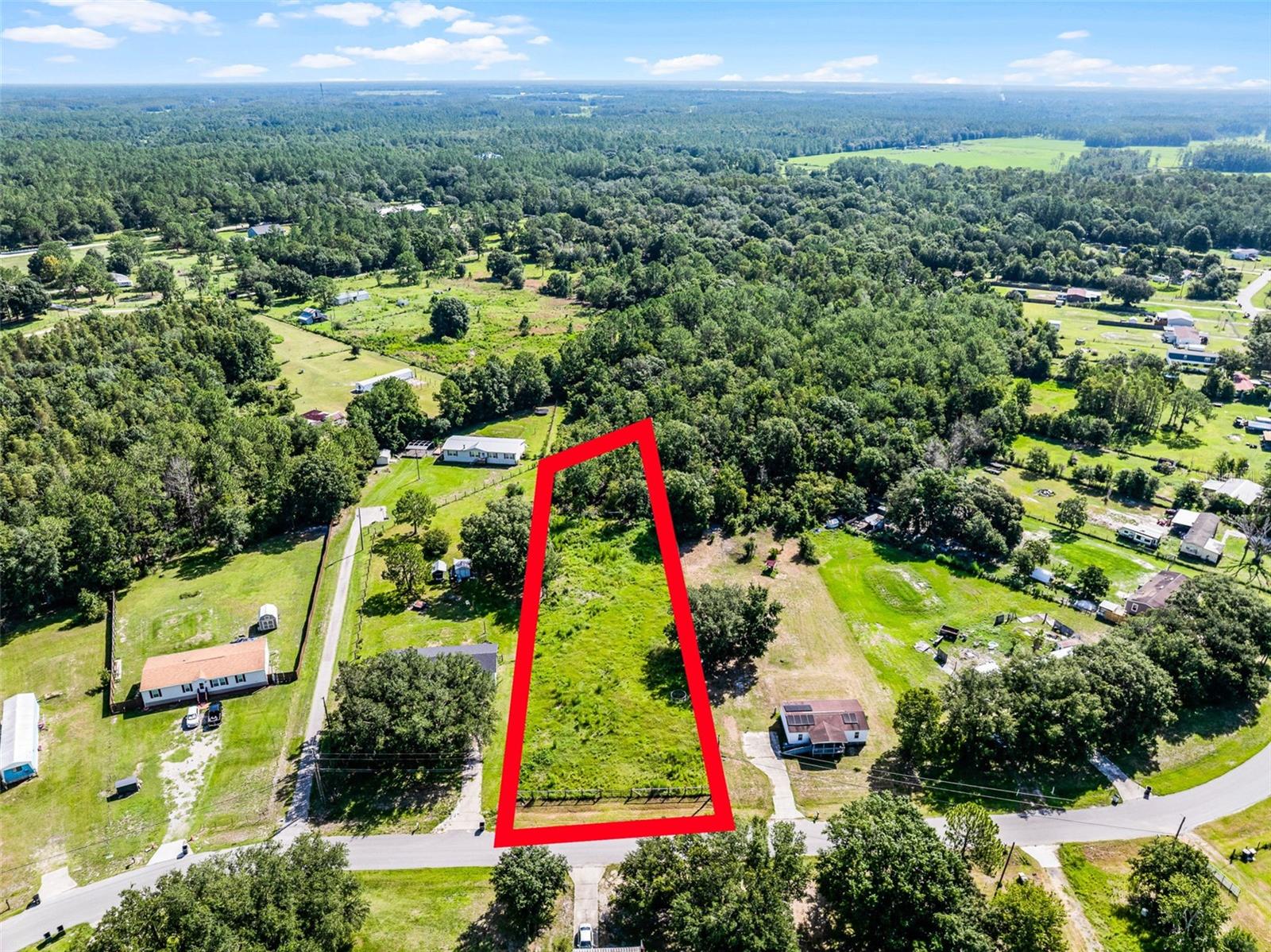 Rare Opportunity To Own A Prime Residential Lot In The Established Saddlewood Community Of North Lakeland. This Dry, Buildable Parcel Is Located On A Quiet Street With Well-Maintained Homes And No HOA, Offering Excellent Flexibility For Custom Builds, Modular Homes, Or Long-Term Investment. Situated Toward The End Of A Peaceful Cul-De-Sac, The Property Spans Just Over An Acre, Is Zoned Agricultural, And Is Fully Fenced For Added Privacy And Functionality. The Agricultural Zoning Allows For Additional Uses Beyond Residential, Such As Gardening, Small-Scale Farming, Livestock, Or Storage Of Equipment, Giving Buyers More Freedom And Utility Than Standard Residential Lots. This Parcel Features A 16-Foot Gate At The Front And A 12-Foot Gate At The Rear, Providing Convenient Access For Trailers, RVs, Or Agricultural Equipment—Perfect For Anyone With Outdoor Hobbies, Work Needs, Or A Rural Lifestyle In Mind. Ideally Positioned Near US-98 And I-4, The Lot Offers Quick Access To Schools, Shopping, Dining, And Major Commuter Routes To Both Tampa And Orlando. Public Utilities Are Nearby (Buyer To Verify Availability And Connection Requirements). With Steady Growth In The Area And Rising Demand For Flexible-Use Land, This Property Presents A Smart Buy For Homeowners Or Investors Looking For Value, Location, And Long-Term Upside. Located In Flood Zone X, Flood Insurance Is Not Required. The Lot Is Moderately Cleared, High And Dry, And Ready For Your New Home. Mobile Homes And Single-Family Homes Are Permitted. Don’t Miss This Rare Opportunity To Secure A Versatile And Valuable Piece Of North Lakeland—Schedule