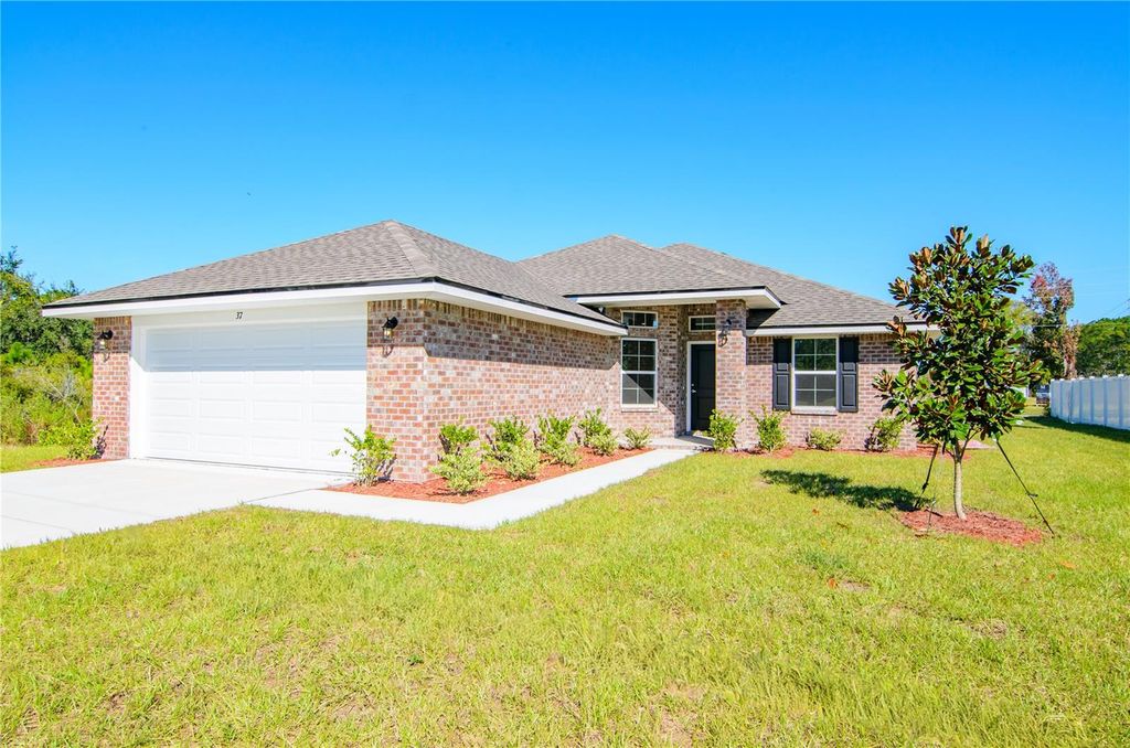 Photo of 77 Pickering Drive, Palm Coast, FL 32164 (MLS # FC316011)