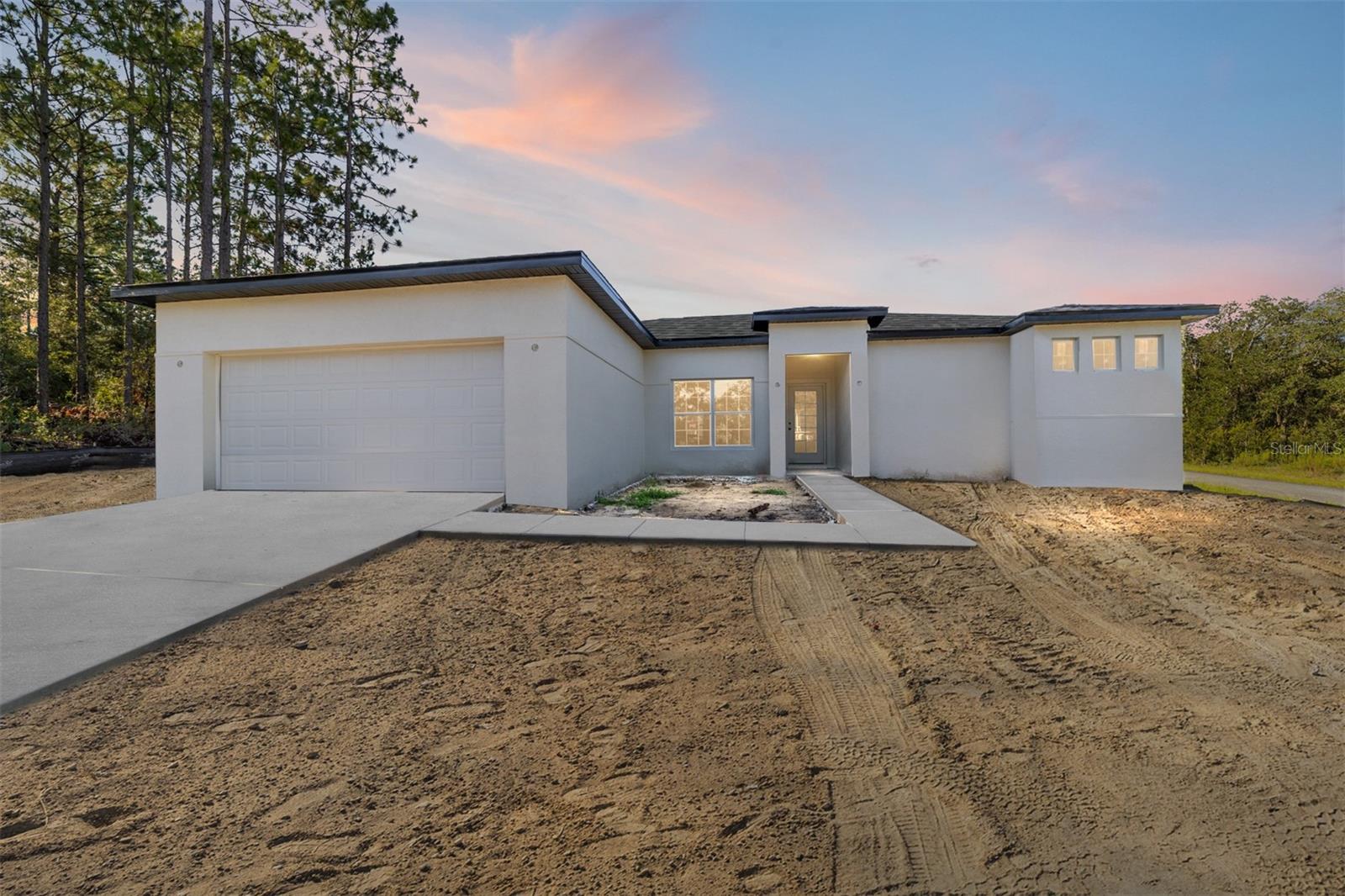 Under Construction. Step into luxury and comfort in this brand-new home on a spacious corner lot in the heart of Citrus Springs. This 3-bedroom, 2-bath home with a separate den offers a thoughtful split floor plan, ideal for both privacy and entertaining. The open-concept kitchen, dining, and family room flow seamlessly together, anchored by a stunning chef’s kitchen featuring a large island, stainless steel range hood, upgraded granite countertops, and premium finishes throughout. The luxurious primary suite offers direct access to the expansive covered lanai and features a spa-inspired bath with a separate soaking tub, oversized walk-in shower, private water closet, and an expansive walk-in closet. Tray ceilings, high-end materials, and abundant natural light elevate every room in the home. Located just a short drive from the crystal-clear waters of Rainbow River, this property blends the charm of Old Florida with the convenience of nearby development in Citrus County—offering easy access to shopping, dining, and a direct route to Tampa. This is modern Florida living at its finest.