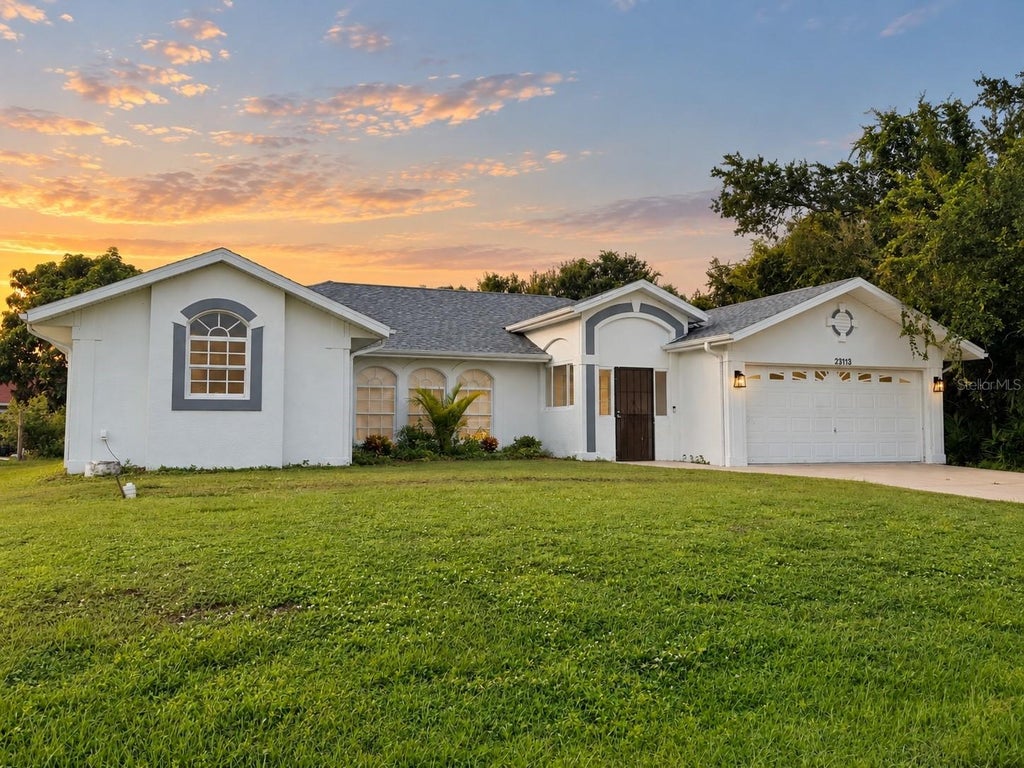 Photo of 23113 Newcun Avenue, Port Charlotte, FL 33980 (MLS # TB8549890)