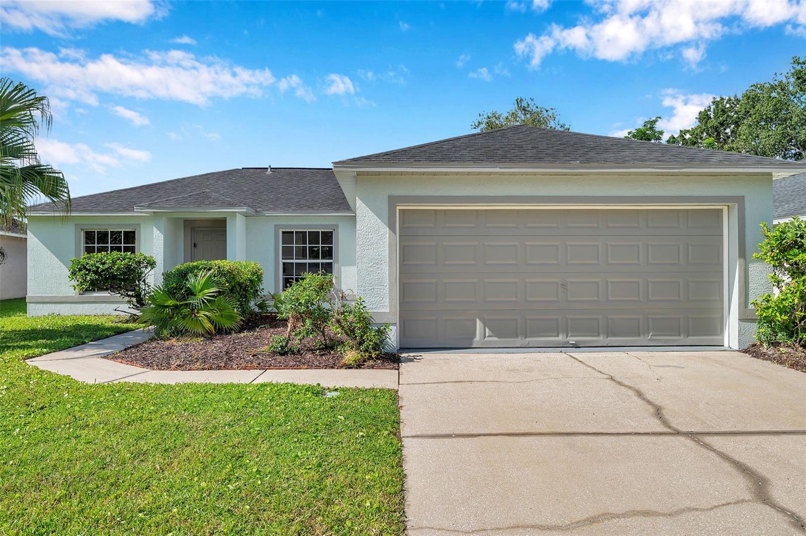 Welcome to this cute and cozy three-bedroom, two-bathroom home in the popular Meadow Pointe I community! Move-in ready with recent updates that include fresh paint inside & out, new carpets, new water heater (2025), and a new A/C (2024). The roof was updated in 2017. The terrific floor plan features a great room with vaulted ceilings and sliding glass doors to the screened patio, an eat-in kitchen with room for a dinette and a closet pantry, and a laundry closet. Split bedrooms provide privacy, with the primary suite on one side featuring a spacious closet and en-suite bath, and the secondary bedrooms on the other side separated by the second bathroom. Additional features include a two-car garage, irrigation system, privacy-fenced backyard, screened patio, and more. Terrific location in Meadow Pointe I with no separate HOA fees, just minutes to the assigned schools, shopping, restaurants, and major roads. The community amenities include a clubhouse, pool, splash pad, fitness center, tennis and pickleball courts, a playground, and more.