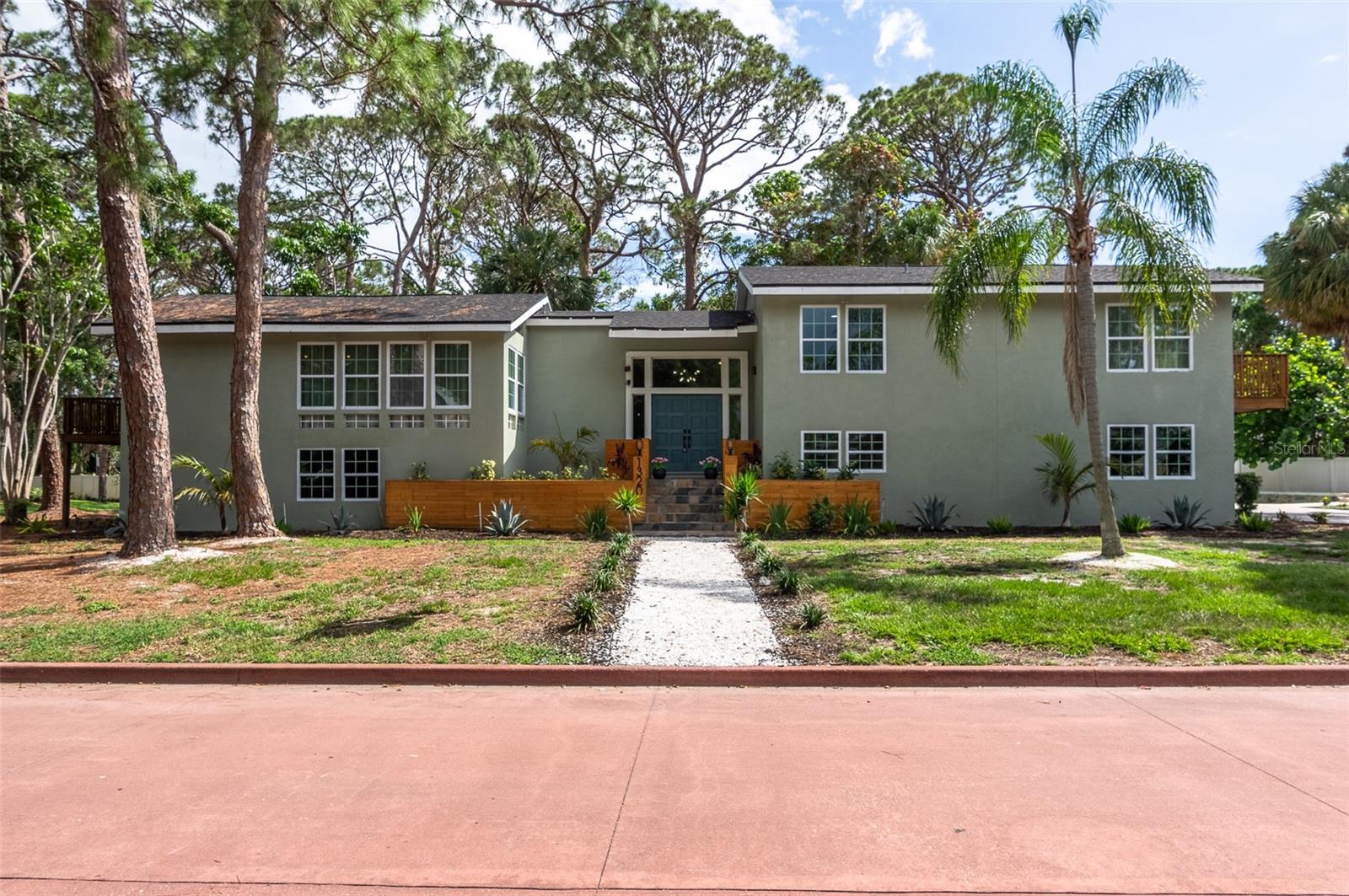 Newly Renovated Home in the Pink Streets Neighborhood of St. Petersburg. Welcome to an architect dream home corner lot. This newly renovated and updated split-level beauty offers the perfect blend of modern luxury, architectural charm, and luxury. The property features vaulted ceilings, plenty of natural light and an airy, open-concept main living area. The expansive living space flows effortlessly into the large open kitchen, large center island, brand-new custom-made cabinetry, Quartz countertops, and stainless-steel appliances. The breakfast nook features an additional built-in bar area, complete with a beverage fridge. This spacious 4-bedroom, 2.5-bathroom is exactly what you need. The pool has been newly resurfaced, brand-new equipment and a new sleek metal fence. The home features a new roof, new windows, new stucco exterior, new landscaping, new interior finishes, floors, trim work, paint, kitchen, and bathrooms. Age of Mechanics: Roof 2023, HVAC 2024 and 2013, Water Heater 2024, New PVC Water Lines 2024.