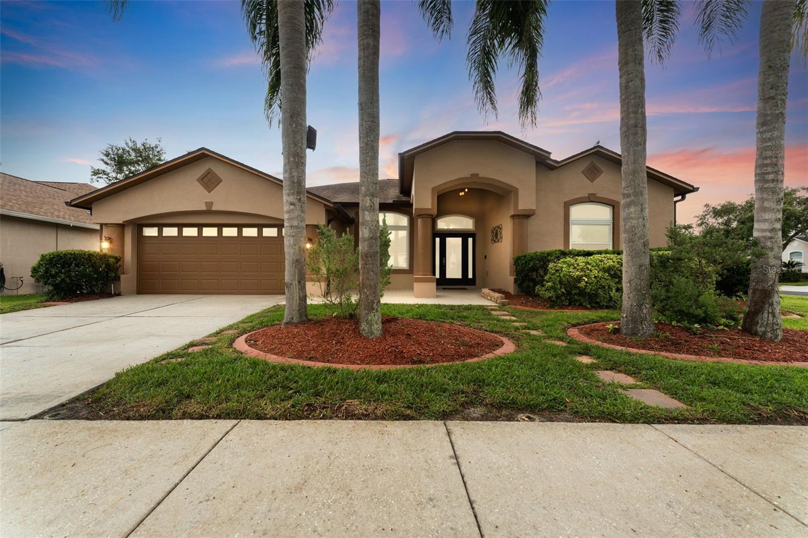 Beautifully updated single-story 4-bedroom, 3-bath home on a scenic pond-view corner lot in the Grand Oaks community. Spacious open floorplan with vaulted ceilings, hurricane impact windows, and a gourmet kitchen featuring granite countertops, 42-inch wood cabinets, stainless appliances, pantry, and breakfast bar. Bathrooms have been meticulously updated with stunning granite countertops and modern finishes. The luxurious primary suite includes dual walk-in closets, double vanities, garden tub, separate tiled shower, and a private office nook. The grand, covered, tall-ceiling screened lanai offers seamless indoor-outdoor living and captivating views of the serene
water. Stamped concrete floors and plenty of room for entertaining or relaxing. The wraparound vinyl-fenced backyard adds privacy and flexibility for pets, gardening, or play. Additional highlights include a 2019 roof, newer HVAC, smart thermostat, attic fan, fresh interior and exterior paint, tile and laminate flooring throughout, inside laundry, and a 2-car garage. Energy-efficient solar panels.
Community has pool, clubhouse, shaded playground, basketball courts, and sand volleyball. Conveniently located near I-75, SR 54, Tampa Premium Outlets, Wiregrass Mall, Costco, dining, and top-rated schools.
First and last month and $2,000 deposit required upon move in. $1,000 of the $2,000 goes to the hoa community. Owner pays for electric, trash, sewer. Tenant pays water, electric, internet.