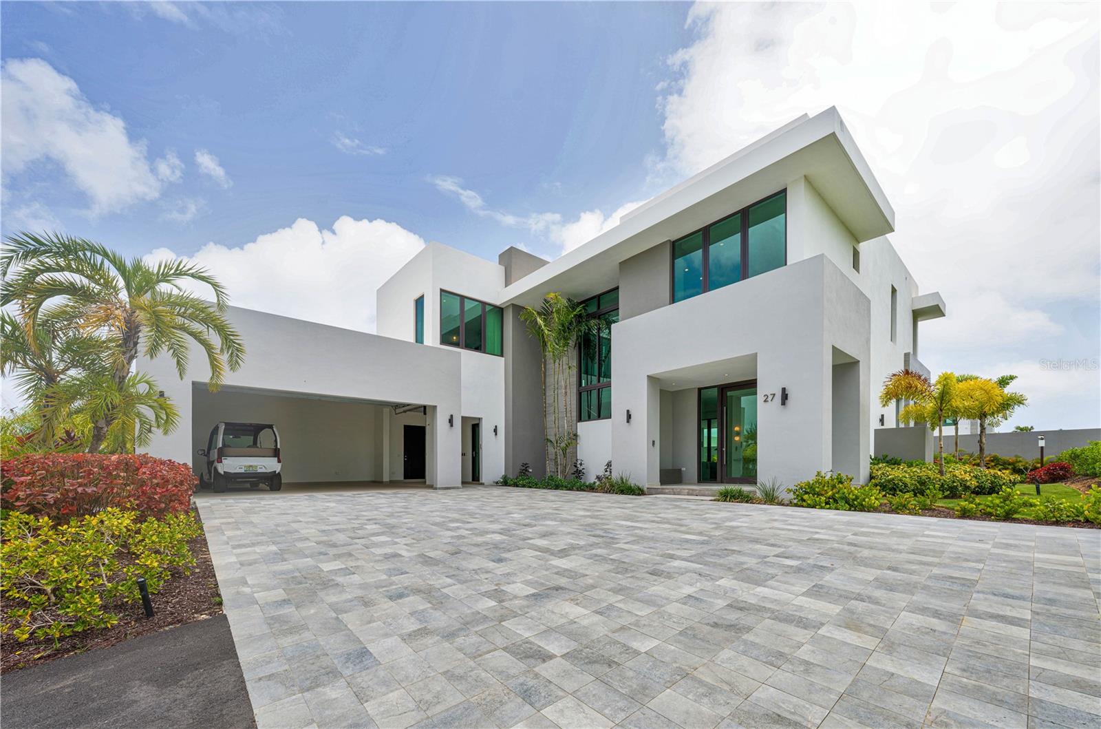***SOLD*** Sitting on a corner quarter-acre lot, 27 The Isles is a brand-new atelier design, thoughtfully integrated with elevated interior elements and hand-selected upgrades to the original build, that redefine contemporary spaces and embody the best within The Isles community. Spanning two stories and approx. 4,550 interior sq. ft., the ground level caters perfectly to the modern homeowner. An open floor plan flooded with vibrant natural light hosts all of your living and entertainment spaces. Each area balances luxury and tranquility with a harmonious blend of neutral tones and rich textures throughout. The centerpiece of 27 The Isles is its formal living room, boasting 21-foot ceilings, terrace facing featuring a climate controlled inground pool and luscious backyard. Framed by floor-to-ceiling sliding doors that easily convert the space into an indoor-outdoor expanse, all of your living spaces in this home are geared to maximize the Caribbean climate. The Eastern facing corner exposure ensures uninterrupted tropical breezes offering a unique and idyllic setting for both relaxation and entertaining. A gourmet kitchen, formal dining room, family room, and dedicated office complete the first level. The second level hosts the entirety of the bedrooms, as well as a secondary laundry suite. Four bedrooms all en-suite, provide ultimate convenience and comfort. The primary encompasses the entire East wing of the second level, creating a sense of separation and privacy complete with stunning bathroom and soaking tub, a spacious walk-in shower, dual vanities, as well two custom walk-in closets and private balcony. Offered fully furnished, equipped and turnkey. The collection of bespoke fixtures, finishes and thoughtful design elements throughout elevate the living experience and set 27 The Isles apart.