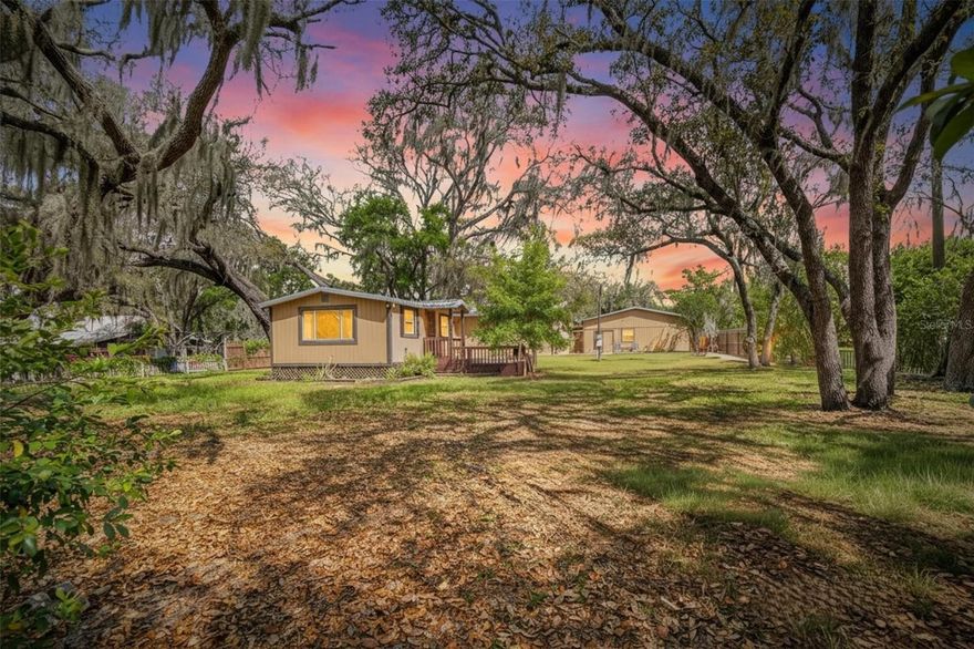 Charming Riverview Property with Space, Flexibility & Endless Potential! Welcome to this 3-bedroom, 2-bath manufactured home nestled on just under half an acre in the heart of Riverview! This property offers the perfect blend of comfort, functionality, and opportunity. Enjoy peaceful mornings and relaxing evenings on your spacious open wooden front porch and covered back porch, perfect for entertaining or unwinding outdoors. The home features a durable metal roof, providing long-term value and peace of mind. Connected to county water, with an additional private well available, offering flexibility and potential savings on utility costs. This property truly stands out with multiple structures and added features: Large detached garage/workshop with a bedroom, bathroom, sink, and open living space — ideal for an in-law suite, guest space, or home business. Additional garage/storage building for tools, equipment, or extra parking. Chicken coop — perfect for those seeking a more self-sufficient lifestyle. With no HOA, plenty of room for your boats, RVs, and toys, plus space to grow—this property offers endless possibilities. Conveniently located near shopping, dining, and major roadways, you get both privacy and accessibility in one!