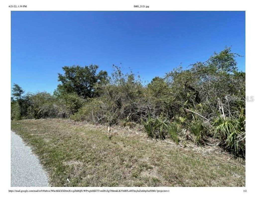 Photo of 7470 Riverton Circle, Port Charlotte, FL 33981 (MLS # A4665700)